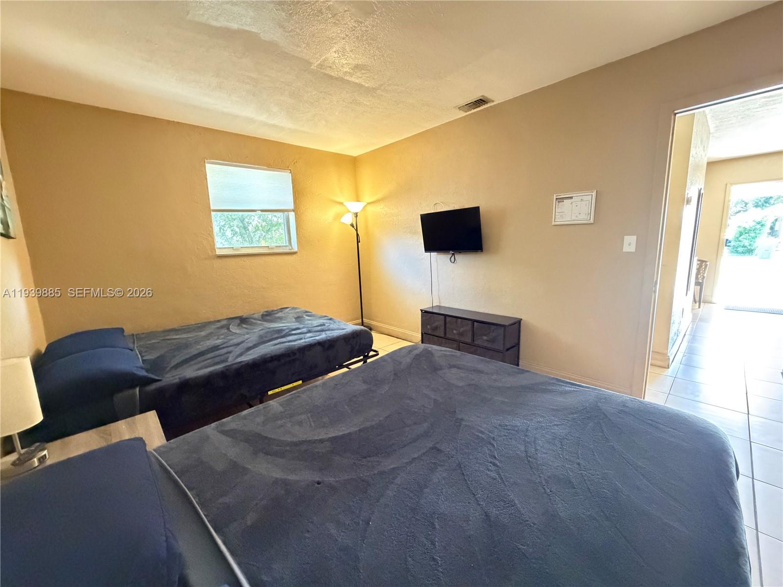 Open-concept living area at 212 2nd Ter - Home in Dania Beach