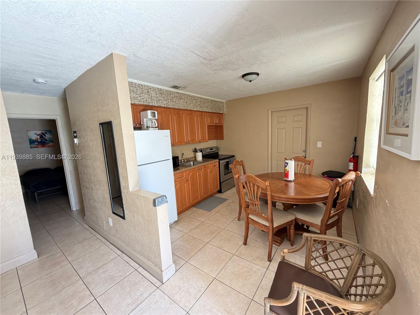 Modern kitchen with designer features at 212 2nd Ter - Home in Dania Beach