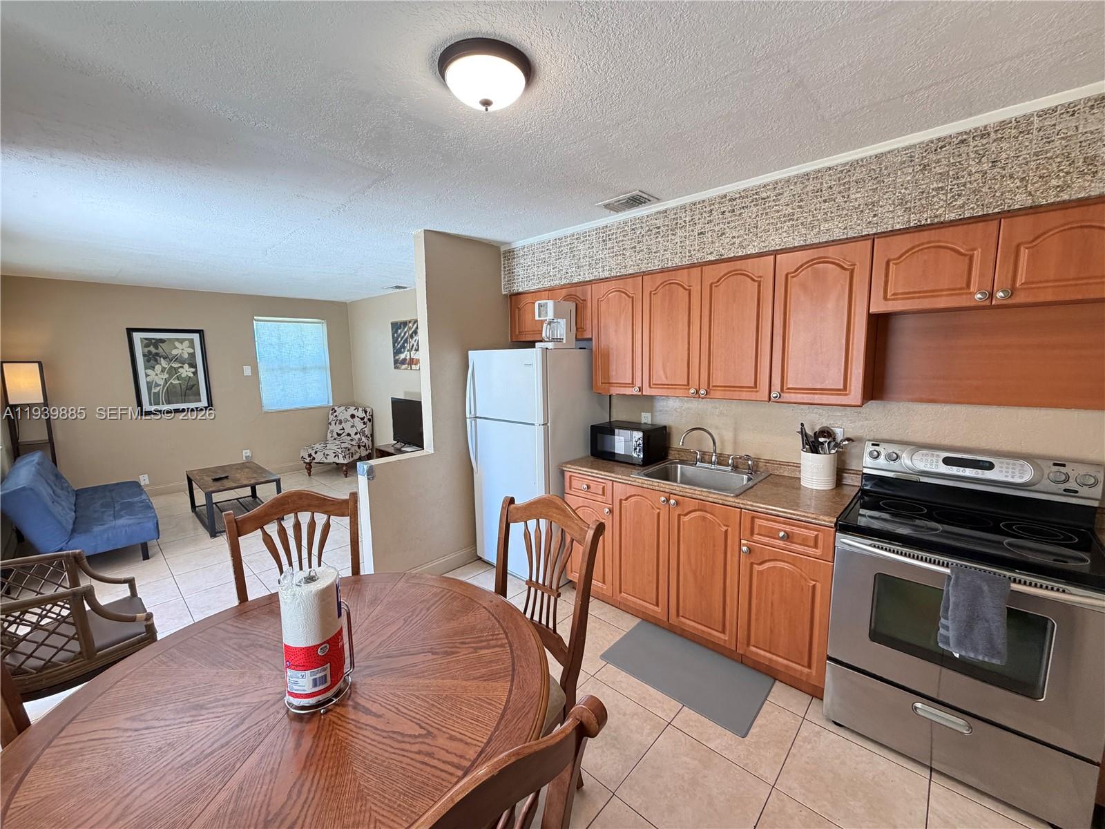 Elegant master bedroom retreat at 212 2nd Ter - Home in Dania Beach
