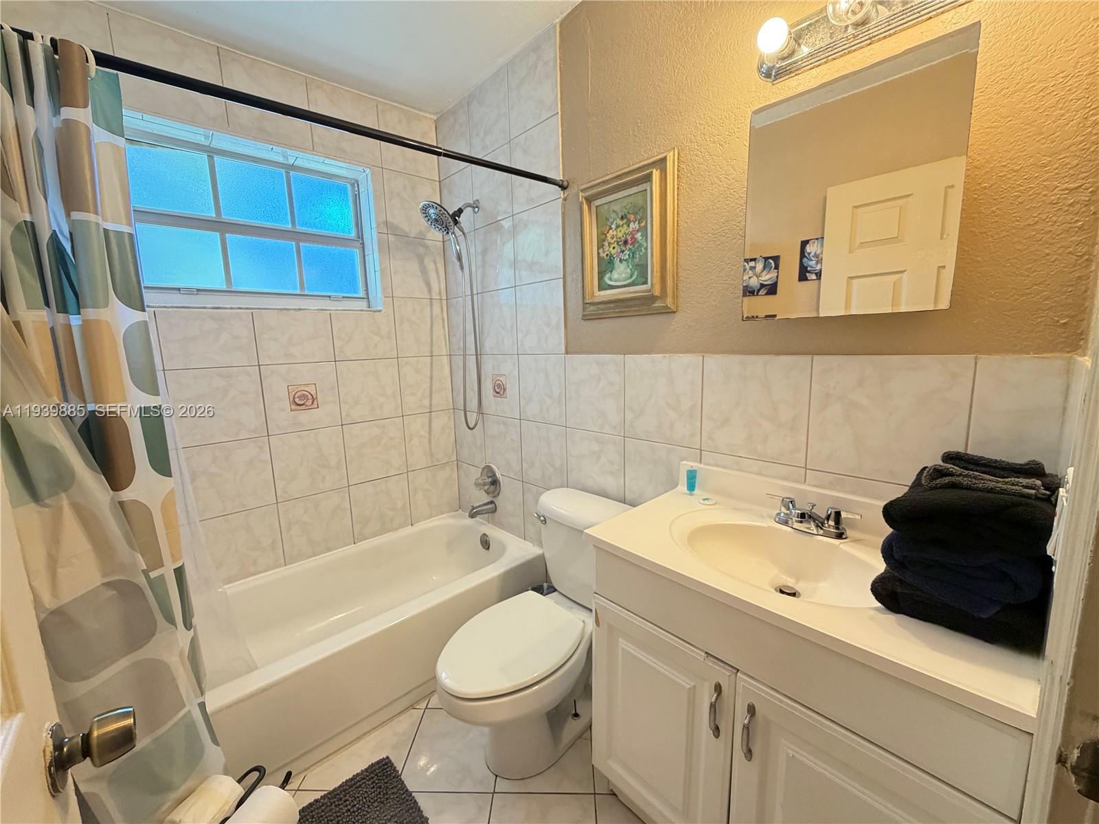 Well-appointed guest bedroom at 212 2nd Ter - Home in Dania Beach