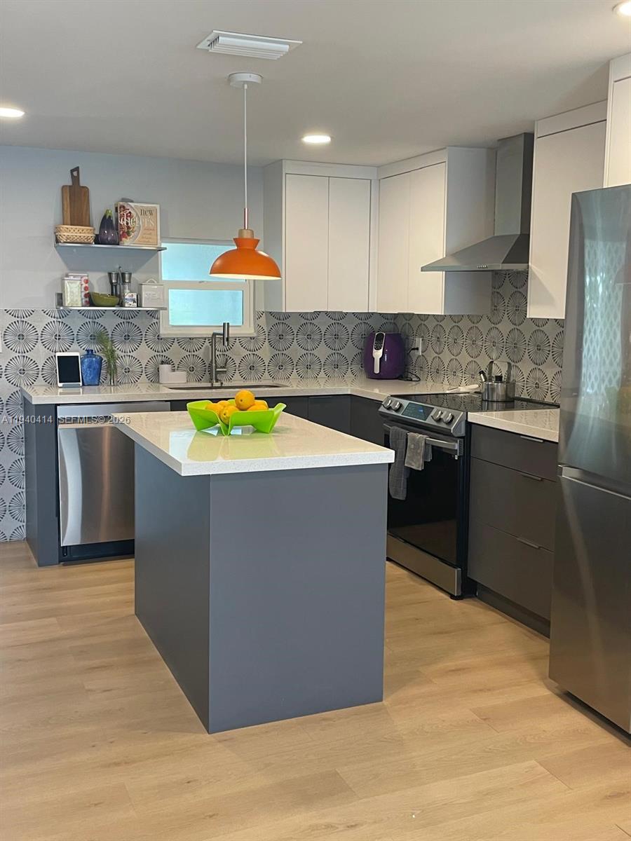 Fully remodeled 3-bed/3-bath manufactured home in the 55+ community of Gateway West with LAND OWNED. Recent upgrades include new laminate flooring throughout, updated kitchen, tankless water heater, and a 1-year-old A/C system. Spacious interior with in-house laundry and screened porch. Home features high-impact doors with electronic keypad lock, accordion shutters, storage shed, and parking for 4+ vehicles. Low HOA. Community amenities include pool and clubhouse, with optional boat/RV storage available for a nominal annual fee. Convenient location near shopping, dining, and Florida Turnpike access, with an easy drive to the Florida Keys. Association is a 55+ community and does not allow residents under 18. At least one buyer must be 55+. Owner occupied; showings after 4:30 PM or weekends with 24-hour notice required.