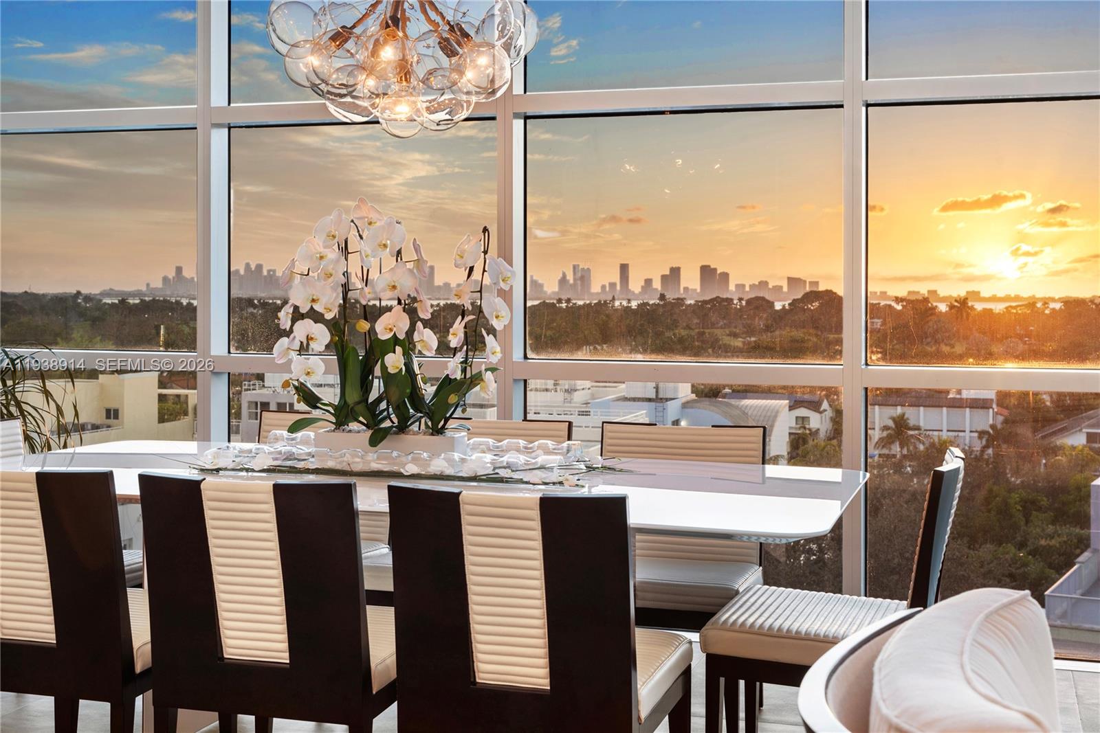 Breathtaking Sunset & Skyline Views from Private, Guard-Gated Aqua Island. This exquisite & rarely available 4BD/4.5BA corner residence offers unparalleled luxury with serene sunset, Downtown Miami skyline, golf course, & bay views. Chic & thoughtfully upgraded, the home features sophisticated interiors, high ceilings, electric blinds throughout, a newer open eat-in kitchen with a large walk-in pantry, Sub-Zero wine cooler, & an expansive great room. Floor-to-ceiling walls of glass flood the space with natural light while perfectly framing the stunning sunsets & cityscape. An art lover’s paradise, the residence boasts top-of-the-line fixtures & finishes, generous wall space for curated collections, & a layout that feels both grand & intimate. The spacious primary suite is exceptionally appointed with a large walk-in closet plus 3 additional closets, & a spa-like bathroom featuring dual vanities, a Toto toilet, & an upgraded glass-enclosed shower. Additional highlights include a tankless water heater, 2 assigned parking spaces, & complimentary valet. Residents enjoy exclusive island living with 24-hour guard-gated security, concierge services, a fitness center, & 2 resort-style swimming pools set on 8.5 acres. The community allows residents to have 2 dogs. Just one block from the beach & boardwalk, minutes from top schools, premier dining & shopping, & only 15 minutes to Miami International Airport.