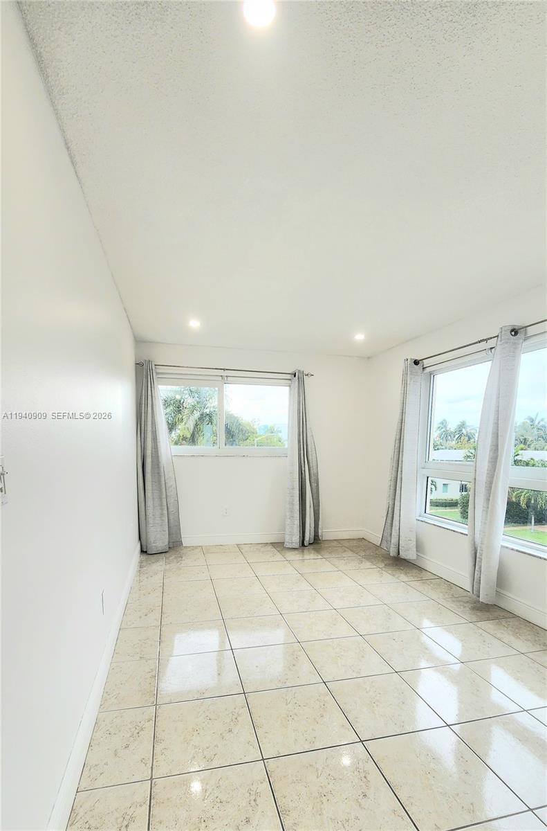 Well-appointed guest bedroom at 1020 94th St - Condo in Bay Harbor Islands
