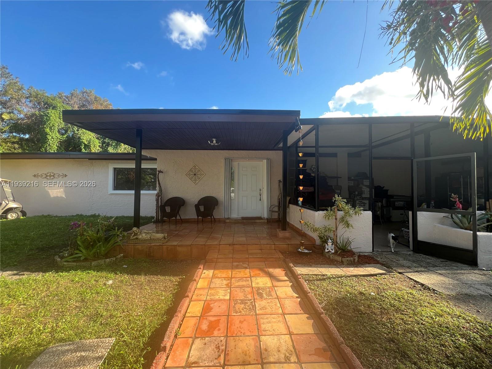 Discover a spectacular investment opportunity in the heart of Redland, conveniently located near Krome Avenue. This charming single-family home offers 2,920 square feet of living space on over an acre of land in a quiet and desirable neighborhood.  Renovated and updated, the home features a large kitchen with beautiful granite countertops, making it ideal for culinary enthusiasts. Inside, you’ll find five bedrooms and three and a half bathrooms. Each of the three additional bedrooms includes a large closet, providing ample storage space throughout the home. The master bedroom is especially spacious, featuring a huge bath and a closet designed to accommodate everyone’s needs. The property is securely enclosed by a durable galvanized metal fence, ensuring privacy and security. On the side of the property, there’s a large open area perfect for storage, projects, or a small business setup. The lot also features two different kinds of avocado trees along with mango and lychee trees, offering a delightful variety of homegrown fruit. The property included a dedicated animal shelter with some divided sections, suitable for birds, pigs, and other farm animals. The property also includes a large metal tank and additional small cement tanks, all set up and ready for fish farming or other aquaculture use.Built with a durable brick exterior, this home combines lasting quality with charm, making it a truly exceptional find.