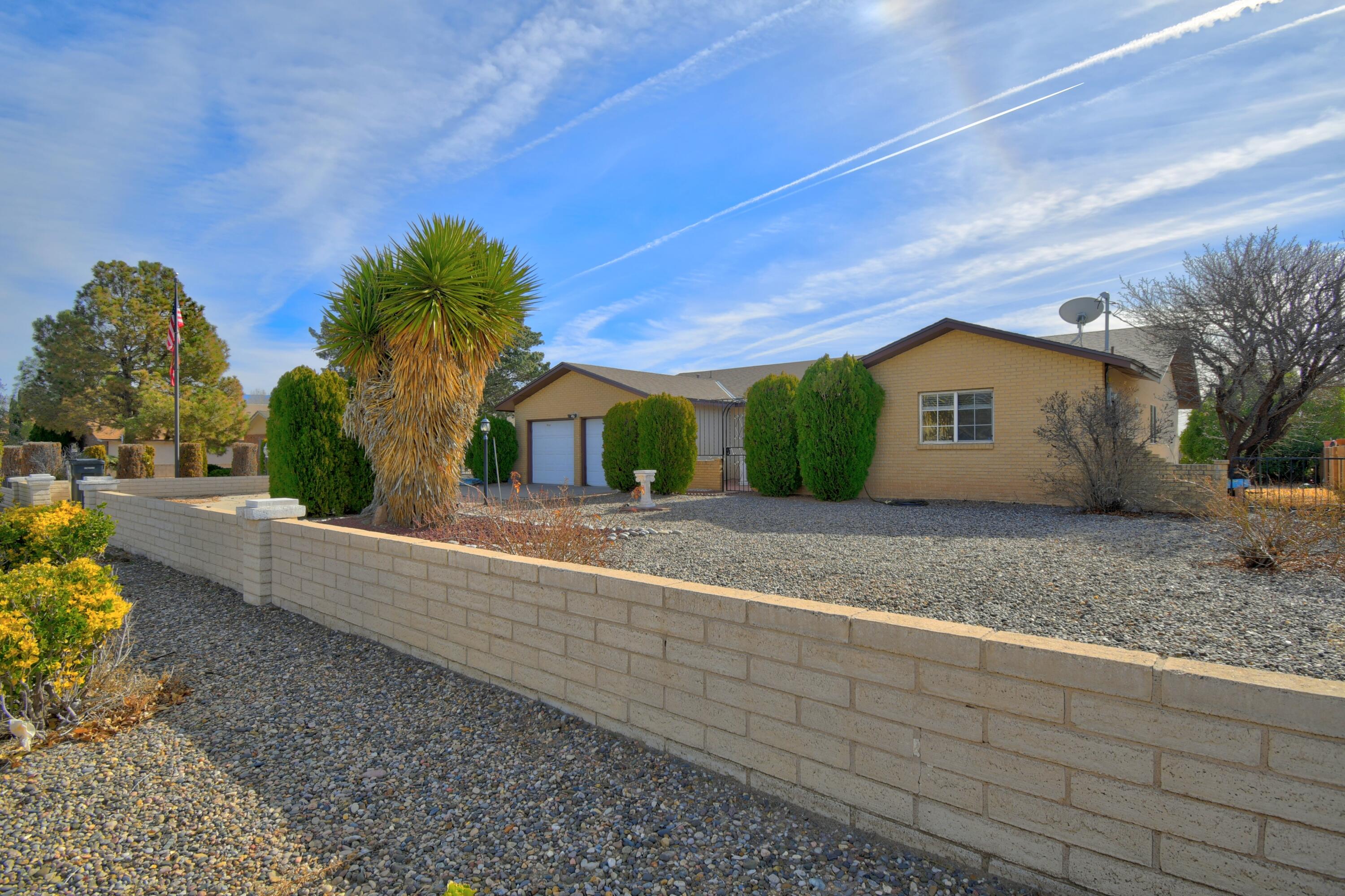 Welcome to this lovely 3-bedroom, 2-bath home in the heart of Rio Rancho! Built by Arturo Boniello, this spacious 2,282 sq ft residence sits on a half-acre lot and features a charming front courtyard entry, two generous living areas, a formal dining room, and an eat-in kitchen. The main living area showcases a corner Kiva fireplace, while the enclosed patio provides a flexible space ideal for a game or playroom, craft area, or sun-filled retreat. Recent updates include a new septic system, termite treatment and stucco patch completed in September 2025, and a freshly painted interior completed in Feb 2026. Seller offering up to $3,000 carpet allowance with acceptable offer.