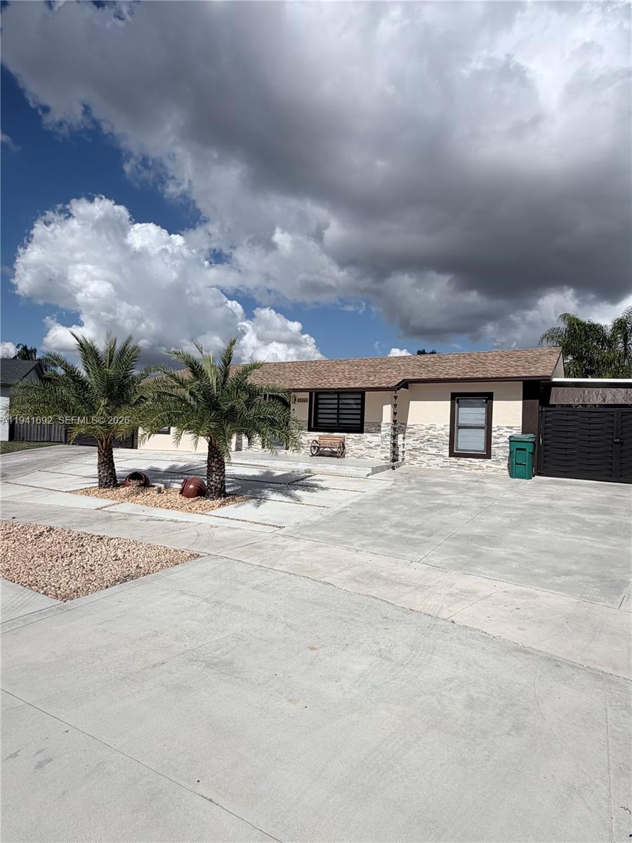 Welcome to this beautifully renovated 4-bedroom, 3-bathroom home, completely remodeled in 2023 with no detail overlooked. The modern kitchen features updated finishes and flows seamlessly into bright, open living spaces, perfect for everyday living and entertaining.All bathrooms have been fully upgraded with contemporary design and quality fixtures. Major improvements include a new roof, new A/C system, and a newly paved driveway, offering peace of mind for years to come.Step outside to enjoy the thoughtfully designed outdoor living area, complete with a pergola and outdoor kitchen, ideal for gatherings and relaxing year-round.This move-in-ready home combines style, comfort, and major system upgrades, an exceptional opportunity you don’t want to miss.