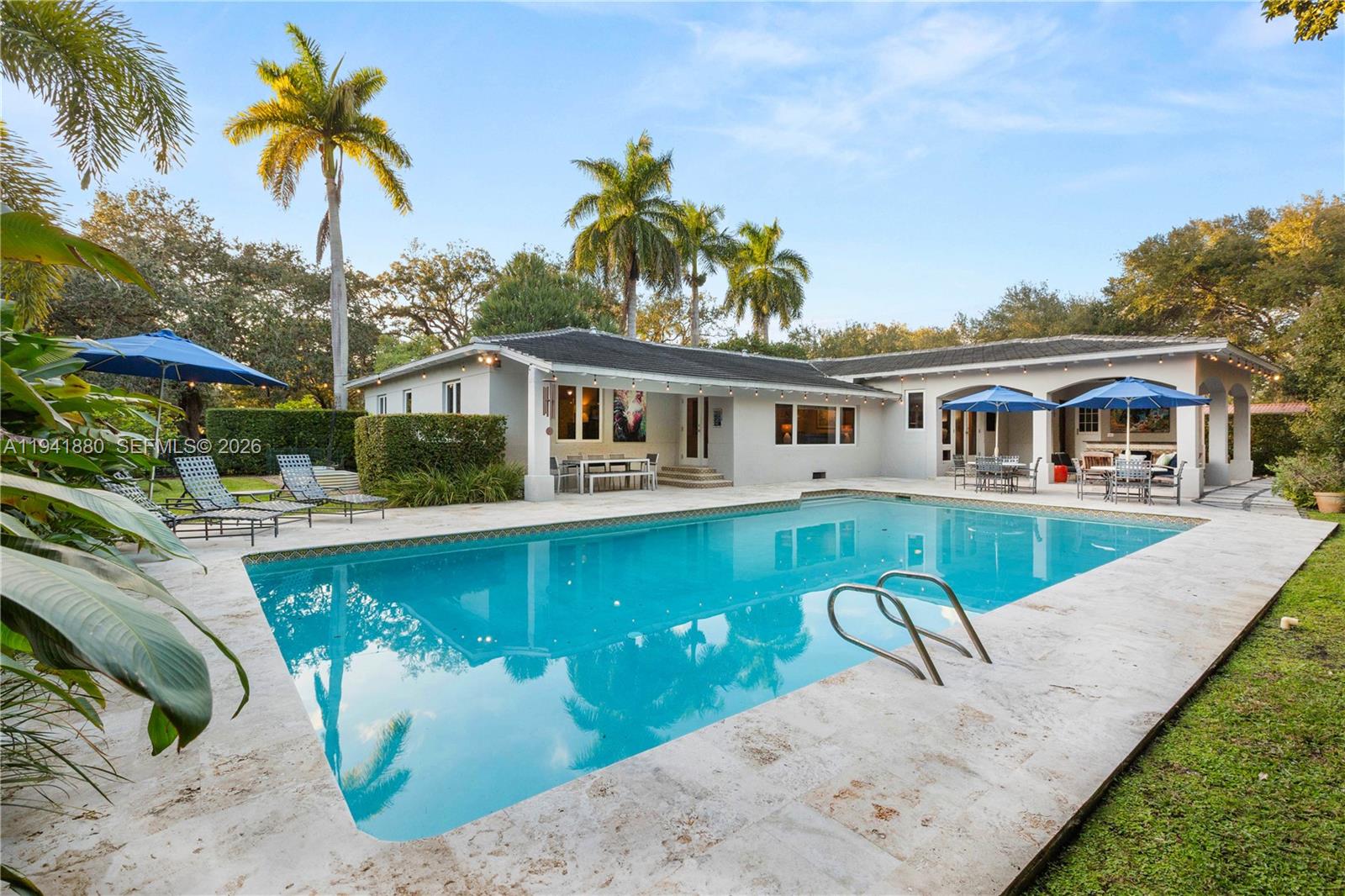 Immaculately maintained and updated home w/ 18,200 lot. Located on one of North Coral Gables’ most special streets. This updated 4BD/4BA plus 2 car garage home blends timeless charm with modern comfort—just steps from the Prado. A desirable split floor plan offers privacy and flexibility, anchored by a spacious ground-level primary suite. Sunlight pours into the bright, open family room, creating the perfect backdrop for everyday living and entertaining. Upgrades include impact windows and a newer roof for peace of mind. Outdoors enjoy true resort-style living with a private sauna, cabana bath, wet bar, oversized pool, and expansive yard surrounded by mature landscaping and fruit trees. A rare, turnkey North Gables gem in an exceptional setting.