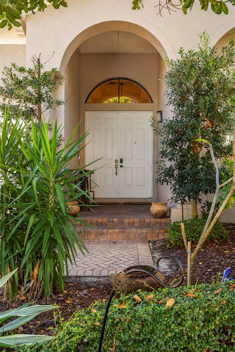 An elegant 4-bedroom, 3.5-bath residence located within the prestigious, guard-gated community of Cutler Cay. This refined home features vaulted ceilings and a dramatic grand foyer, creating a light-filled and impressive entry. The chef’s kitchen is appointed with premium stainless steel appliances and granite countertops, including a new refrigerator and washer/dryer installed in 2022.The expansive primary suite serves as a private retreat with a spa-inspired bath, dual vanities, and a spacious walk-in closet. Additional highlights include the original roof and a complete exterior wired camera system valued at inception at $11,000 for added security and peace of mind.Outdoors, the property is framed by lush natural preserves and offers a fully turfed yard, custom mist spray control system, and professionally maintained landscaping. Residents enjoy a resort-style lifestyle with access to an exclusive clubhouse, resort pool, state-of-the-art fitness center with sauna and steam rooms, tennis, basketball, and pickleball courts, playground, and 24-hour security. HOA includes cable, high-speed internet, alarm monitoring (ADT), and professional front-yard landscaping maintenance.