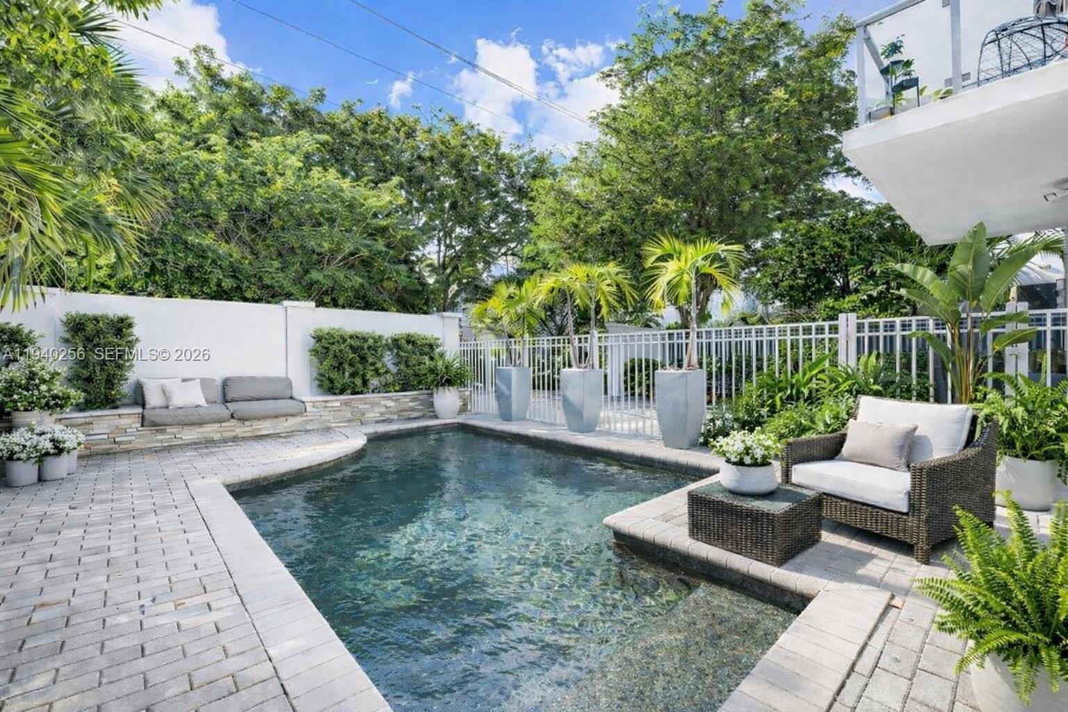 Introducing a rare Victoria Park offering that lives like a true single-family residence with an unbeatable location, steps away from Las Olas Blvd. This expertly maintained 3BD/3.5BA modern residence is designed for elevated living and effortless entertaining, offering sun-filled interiors, soaring ceilings, and a masterfully curated floor plan, blending the kitchen, living, & dining areas all on the 2nd floor. The expansive open living level is anchored by a chef’s kitchen with natural GAS range, dual islands, quartz countertops, and high-end appliances. The primary suite serves as a tranquil retreat with dual walk-in closets, a spa-inspired bath with separate tub & shower, and 2 private terraces. Additional highlights include a metal roof, walled courtyard with private pool, kitchen reverse osmosis water system, and a spacious 2-car garage with an oversized driveway for 4 additional cars. Just steps from Las Olas Blvd's world-class dining, shopping, and nightlife, and minutes from the beach and airport. This is truly a premier Victoria Park address defined by unbeatable walkability and effortless access to the best of Fort Lauderdale! No HOA.