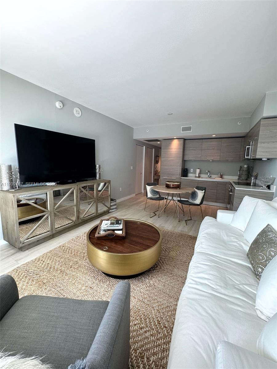 Experience elevated living at DUA Brickell in this thoughtfully designed and maintained 1-bedroom, 1.5-bath residence. The unit features a spacious walk-in closet, in-unit washer and dryer, porcelain tile flooring throughout, and a modern kitchen equipped with premium Bosch appliances. Floor-to-ceiling sliding glass doors provide abundant natural light and showcase bay and city views. Balcony features a bump-out extension, offered in only a limited number of units. One assigned parking space included. DUA Brickell offers resort-style amenities, including a state-of-the-art fitness center, DUA Spa by K’Alma, on-site dining with Rosa Negra and Ahu Mar, a 10th-floor 200 ft heated pool with cabanas and outdoor bar plus an exclusive 54th-floor Skydeck with private rooftop pool. Ideally located in the heart of Brickell, just steps from world-class dining, shopping, and entertainment. ***Tenant-occupied through July 31, 2026. Rent has been prepaid through the end of the lease term; any unearned prepaid rent and security deposit will be transferred to the buyer at closing. Furniture is included in the sale. Ideal for buyers planning a future primary or secondary residence in one of Brickell’s most sought-after buildings. See broker remarks for additional information.***