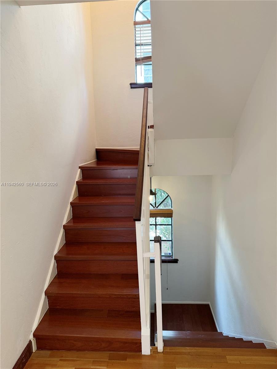 All the charms of Coral Gables living await at Villas de Majorca. This rare tri-level private townhome offers the perfect blend of neighborhood tranquility and urban convenience. The first level features two dedicated parking spaces, generous storage, and a serene patio adorned with mature orchids. The second floor showcases an inviting living and dining area, a well-appointed kitchen with granite countertops and updated appliances, and a convenient powder bath. The third level hosts two spacious bedrooms, each with its own updated en-suite bath and extra-tall closets. A unique opportunity in one of the Gables’ most desirable communities—schedule your private showing today.