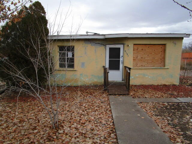 Open floor plan, large lot, fenced, storage building, covered patio. Great location close to schools, parks, shopping, downtown business district, employment, Rio Grande River bosque with easy access to Hwy 500 to I-25.  Considerable repairs required; Broker and Buyer must sign a Hold Harmless Agreement prior to accessing property. Good opportunity to restore for equity.  All information herein has been obtained from MLS history and/or tax records. Square feet and other information has been obtained from county tax records.