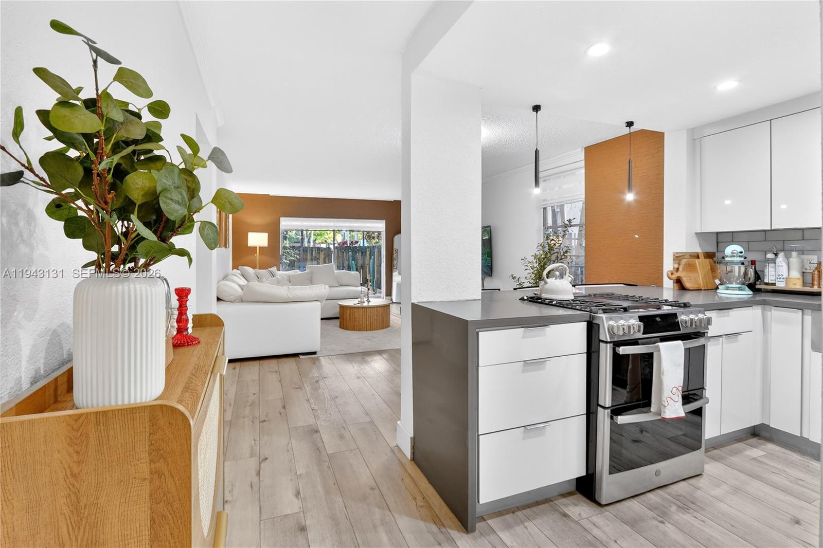 Ideally located between Dadeland Mall and Gulliver Prep just east of US-1, this first-floor Pinecrest residence has been thoughtfully remodeled throughout. The home features two well-designed bathrooms and a spacious kitchen equipped with stainless steel appliances and a generous bar-height counter ideal for everyday living. A lush, private patio opens directly to the pool, offering an easy indoor-outdoor flow and a relaxed, resort-style setting. Assigned parking and a pet-friendly building add everyday convenience. A newer AC system and a centrally maintained boiler in the building add comfort and peace of mind.