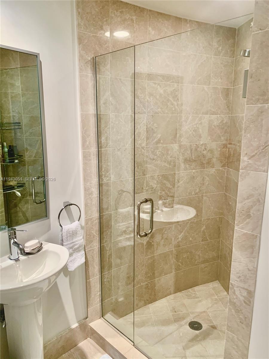 Well-appointed guest bedroom at 17001 Collins Ave - Condo in Sunny Isles Beach