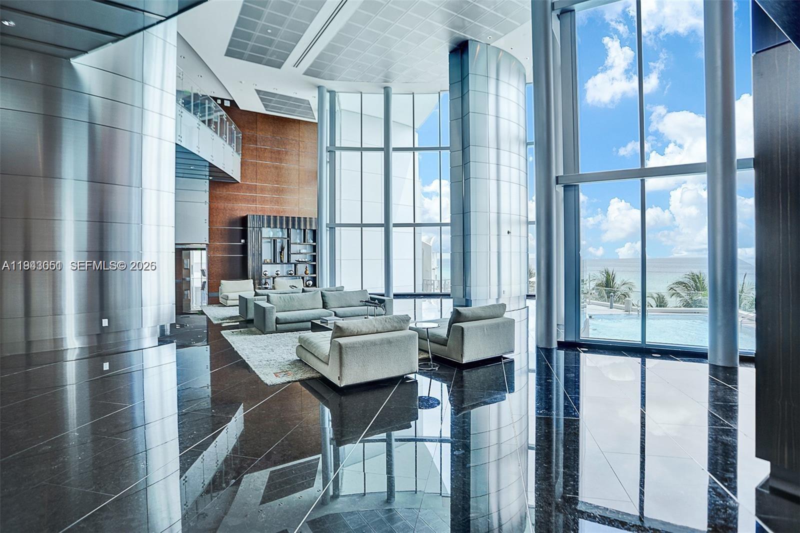 Spacious living room with panoramic views at 17001 Collins Ave - Condo in Sunny Isles Beach
