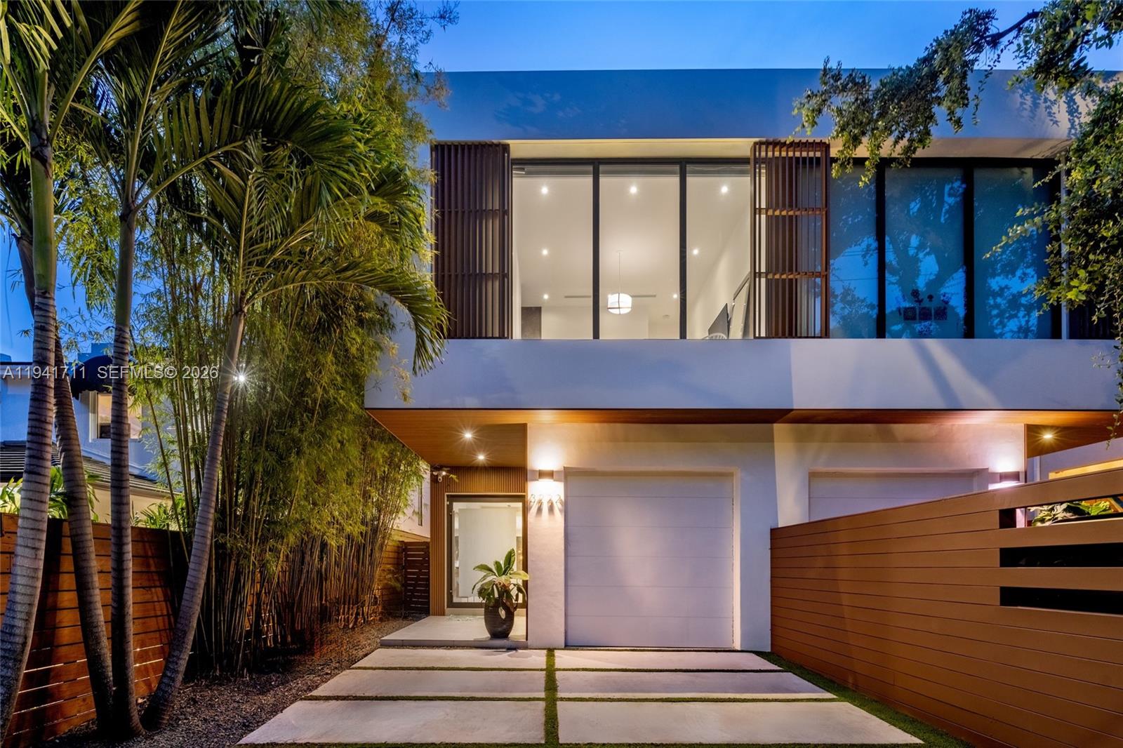 Welcome to this customized, exquisite 2019-built 4-bedroom, 3.5-bath townhouse just steps from CocoWalk in the heart of Coconut Grove. Spanning nearly 3,000 interior square feet, this modern residence features porcelain faux-wood floors, custom millwork, recessed lighting, and expansive open living areas designed for both everyday comfort and entertaining. The chef’s kitchen is outfitted with top-of-the-line Bosch appliances, including a gas stove, wall oven, wine cooler, refrigerator, freezer, Wi-Fi-enabled in-cabinet coffee maker, and an oversized island that serves as the home’s centerpiece. The primary suite offers a tranquil retreat with floor-to-ceiling windows and a spa-like bath featuring a smart Toto toilet and an oversized multi-head shower.  Bedrooms 2 and 3 are connected by a Jack-and-Jill bathroom, and Bedroom 4 functions as a private guest suite with its own ensuite bathroom. All bedrooms feature custom-built closets for exceptional storage. Outdoors, enjoy a custom made salt water chlorine heated pool, summer kitchen including a gas-powered grill, outdoor shower, and a custom children's play fort ideal for entertaining or family gatherings.  The expansive rooftop deck - complete with a second summer kitchen including a gas-powered grill, sink, multiple beverage coolers, and more - offers stunning views of downtown Coconut Grove and Biscayne Bay and a blank canvas to create your ultimate rooftop oasis in one of South Florida’s most desirable neighborhoods.