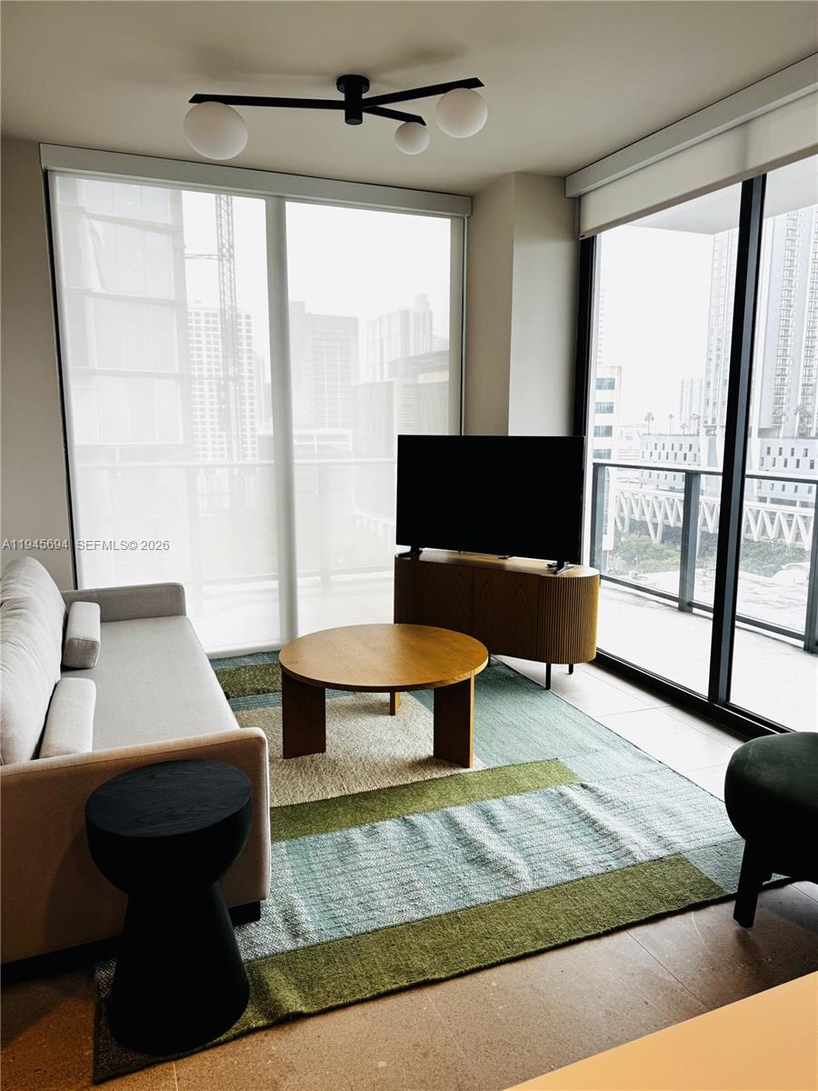 Fully furnished 2-bed/2-bath residence with 825 SQ FT at The Crosby, a brand new construction luxury tower in Miami Worldcenter. Interiors curated by AvroKo feature 9’ ceilings, floor-to-ceiling glass, balcony, and finished closets. Italian kitchen with Bosch appliances, refrigerator/freezer, convection oven/microwave, cooktop, and dishwasher. Spa-style bath and custom Italian vanity. Full-size W/D, lighting with dimmers, smart-home system, and keyless entry via app, code, or keycard. The 34-story tower offers 22,000+ SF of resort amenities: rooftop pool with jacuzzi, cabanas, grills, rooftop restaurant/bar, fitness center with saunas and plunge pools, coworking, lounges, game room, curated art, 24/7 security & concierge. Near Miami Worldcenter; minutes to Wynwood, Brickell, South Beach, and MIA airport.