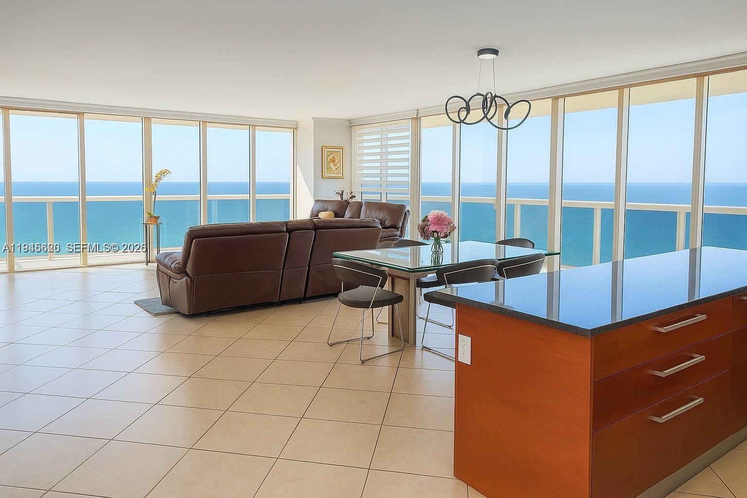 Luxury Oceanfront High-Rise | Panoramic Views | Wrap-Around BalconyLive like you’re on vacation every day in this fully renovated oceanfront high-rise residence with breathtaking, panoramic water views. Floor-to-ceiling windows wrap the open-concept living space, pouring in natural light and framing endless ocean vistas from nearly every angle. Step outside to an expansive wrap-around balcony—the ultimate backdrop for entertaining. Enjoy unmatched amenities including 24-hour security and valet, five heated pools, an oceanfront spa, fully equipped fitness center, and private beach access. Turnkey, refined, and unforgettable—this is coastal living at its finest rentable up to 12x/year.