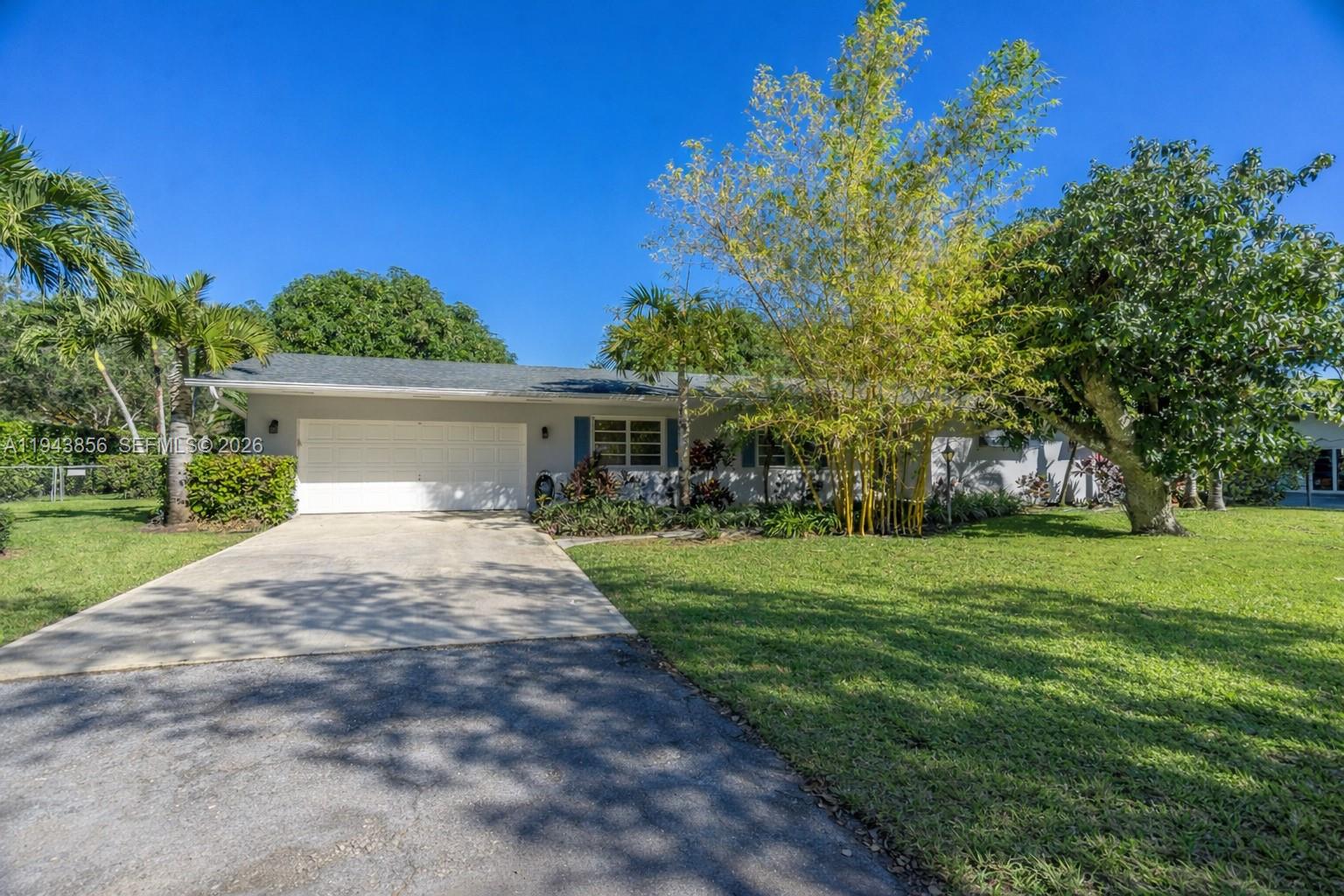 Step into the relaxed charm of Palmetto Bay with this beautifully maintained 3 bedroom, 2 bath home, set on a 18,000 sq. ft. corner lot and available for immediate move-in. Freshly painted and featuring laminate flooring throughout, the home is bright and welcoming. The kitchen showcases granite countertops and stainless steel appliances, opening into well designed, inviting spaces ideal for everyday living. Enjoy seamless indoor-outdoor living with a covered, screened-in patio, perfect for morning coffee or evening gatherings. A 2 car garage adds convenience and extra storage. Ideally located within short distance to Coral Reef Elementary School and Coral Reef Park and just minutes from shopping, dining and major roadways. This home offers the perfect balance of space, privacy, and location - a place you’ll truly enjoy coming home to!