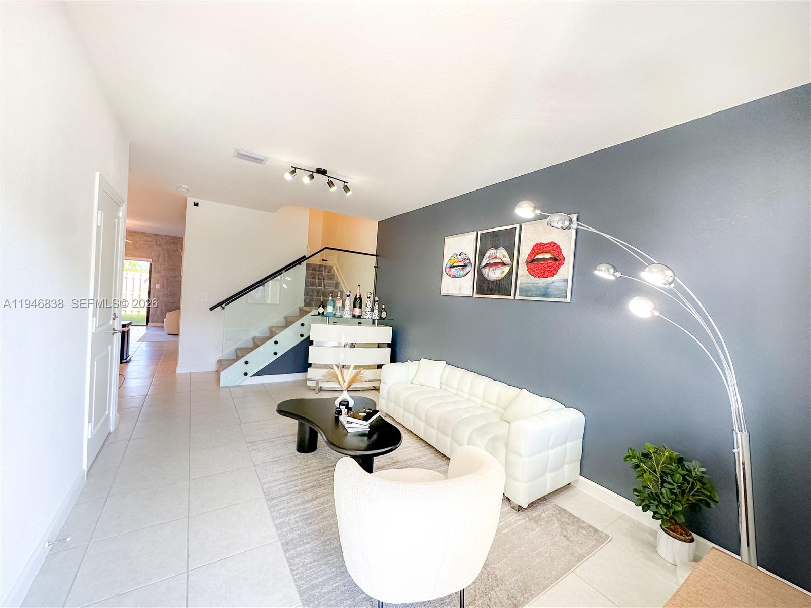 This beautiful new construction townhouse It is SPACIOUS with 3 large bedrooms and 2 full bath on the second floor and a half bath on the first floor. Impact window, an access door from the back fence enhances convenience for outdoor activities. No Backyard neighbors. Club house. 1 car garage and PARKING SPACE PLUS 3 SPOTS ON THE DRIVE WAY.