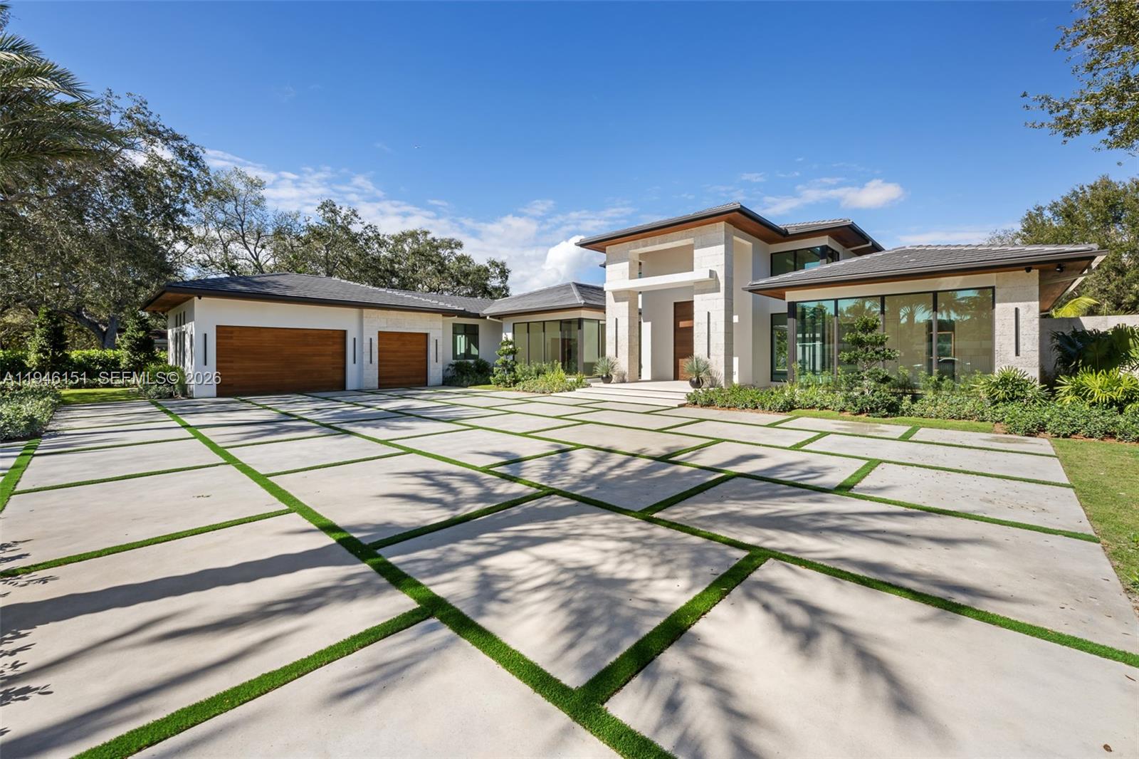 Exquisitely curated, privately gated, single-level estate featuring 7 Bedrooms 8.5 Baths including private primary wing with terrace, coffee bar, dual commodes, and outdoor shower. Chef’s kitchen showcases Pedini Italian cabinetry, Sub-Zero/Wolf appliances, dual islands, hidden pantry and coffee station, Taj Mahal quartzite counters and wine refrigeration. Italian lacquered doors throughout, Graff fixtures, Toto smart toilets, full home sound system, lighting, pool, and security controlled by phone / iPad. Custom theater with stadium seating and full bath. Award-winning Sensi Casa interiors featuring wide-plank oak floors, designer wallpaper, wood paneling, and linear fireplace. Resort-style pool with sunken fire-pit lounge, spa, lush landscaping, summer kitchen. Oversized 3-car garage. Separate Guest house/wellness retreat with custom sauna & cabana bath.