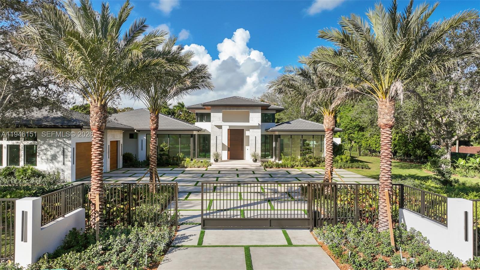 Exquisitely curated, privately gated, single-level estate featuring 7 Bedrooms 8.5 Baths including private primary wing with terrace, coffee bar, dual commodes, and outdoor shower. Chef’s kitchen showcases Pedini Italian cabinetry, Sub-Zero/Wolf appliances, dual islands, hidden pantry and coffee station, Taj Mahal quartzite counters and wine refrigeration. Italian lacquered doors throughout, Graff fixtures, Toto smart toilets, full home sound system, lighting, pool, and security controlled by phone / iPad. Custom theater with stadium seating and full bath. Award-winning Sensi Casa interiors featuring wide-plank oak floors, designer wallpaper, wood paneling, and linear fireplace. Resort-style pool with sunken fire-pit lounge, spa, lush landscaping, summer kitchen. Oversized 3-car garage. Separate Guest house/wellness retreat with custom sauna & cabana bath.