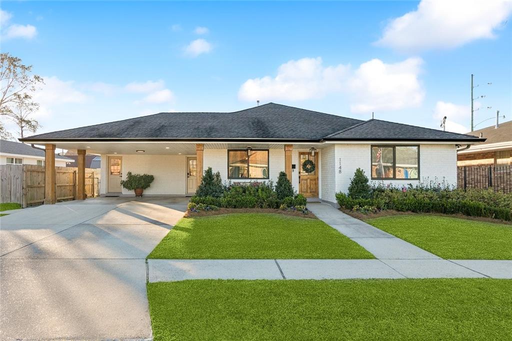 Stunning & meticulously renovated in 2024.  Elegant marble countertops extend seamlessly up kitchen walls; gold accents, pot filler, gas stove and breakfast nook. Premium stainless steel appliances included with top-tier lighting fixtures. Dining area with framed textured sage walls featuring wet bar with marble slab and wine cooler. Inviting foyer with designer wall paper and wainscoting walls. Easy maintenance wide vinyl plank wood floors. Great room layout seamlessly blends kitchen, dining and living areas into one cohesive airy space- Ideal for entertaining. PREPARE TO BE CAPTIVATED! Primary suite is a retreat with Spa-inspired private ensuite bath; featuring freestanding soaking slipper tub and seamless glass shower with tile wet wall. Generous walk in closet! Recessed lightening throughout. A TRUE showstopper! Generously sized laundry room has sink, counter and more with washer & dryer included. Double carport has bonus space located under carport (office/ craft room?) also rear of house has extended living space able to be bonus room/ office with access to rear yard.2024 renovations include All new plumbing and electric throughout, new storm windows, new doors, light fixtures, all new kitchen, floors and more! home has never flooded. buyer or buyer agent to verify measurements during inspection period. Shed in rear is hardwired for electric with panel box but is not connected. Located near popular vastly traveled Veterans blvd, with easy access to I10, near sought after schools, house located on a wide road with like houses. Located in heart of popular Metairie. **please NO FOOD NO DRINKS INSIDE. NO FURNITURE OR CURTAINS ARE INCLUDED IN SALE PLEASE WHEN VIEWING DO NOT MOVE FURNITURE!