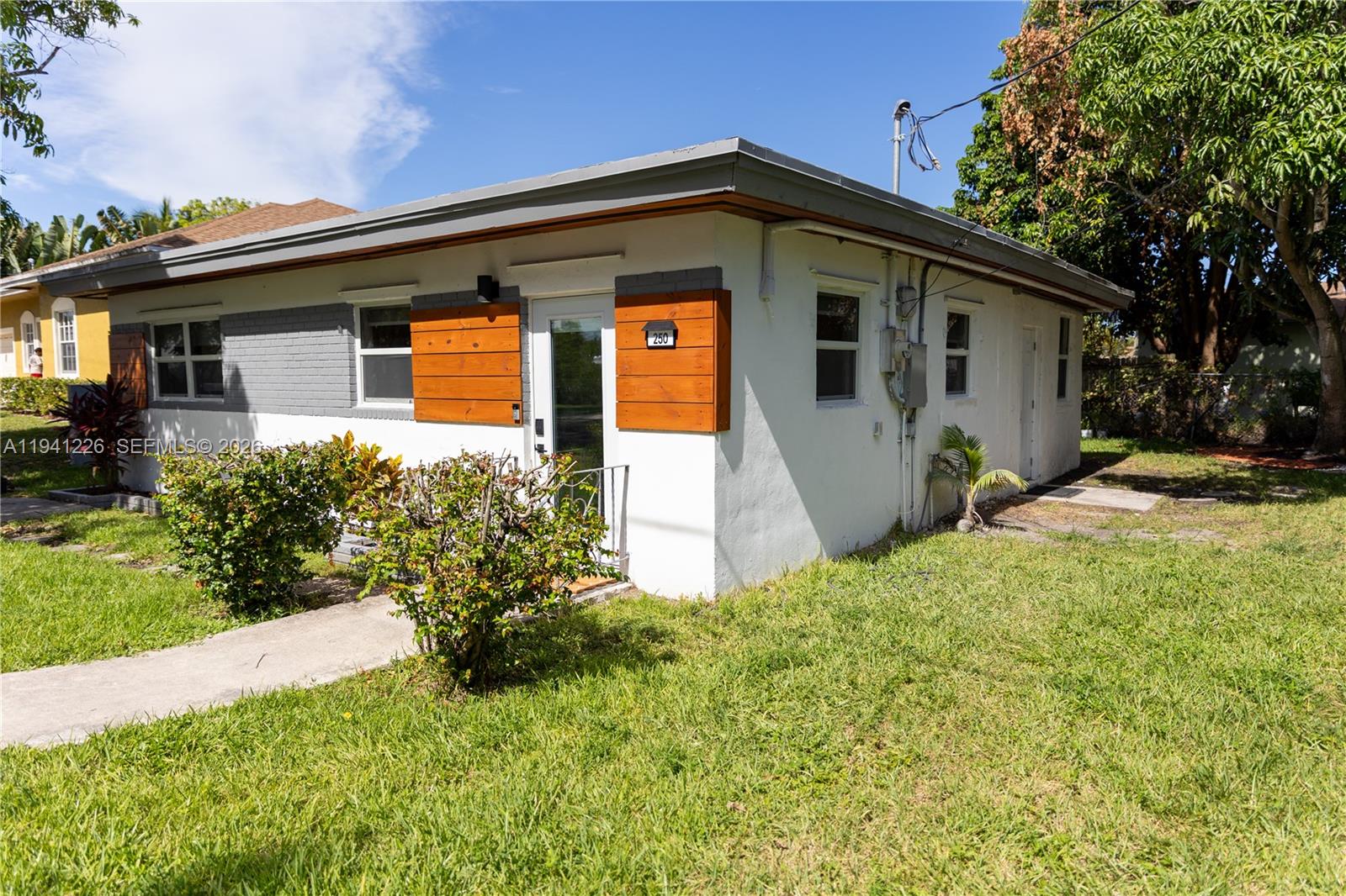 Open-concept living area at 250 14th Way - Home in Dania Beach