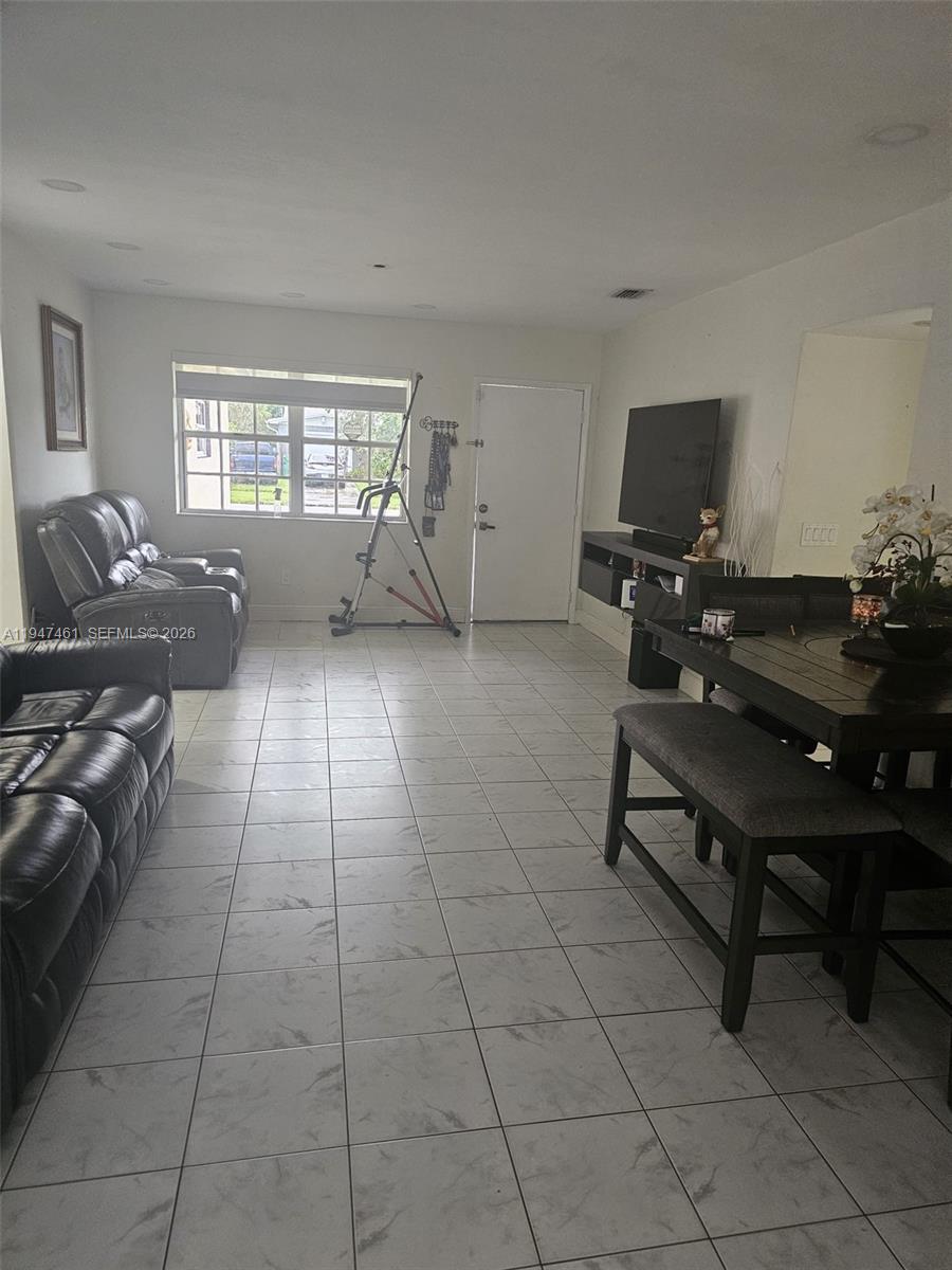 Beautiful property well treated in the desirable neighborhood of Whispering Pines at Cutler Bay. The concrete driveway on the side is great for parking any type of vehicle, car, truck, boat, RV, etc. A converted garage with a private entrance is very practical for storage.