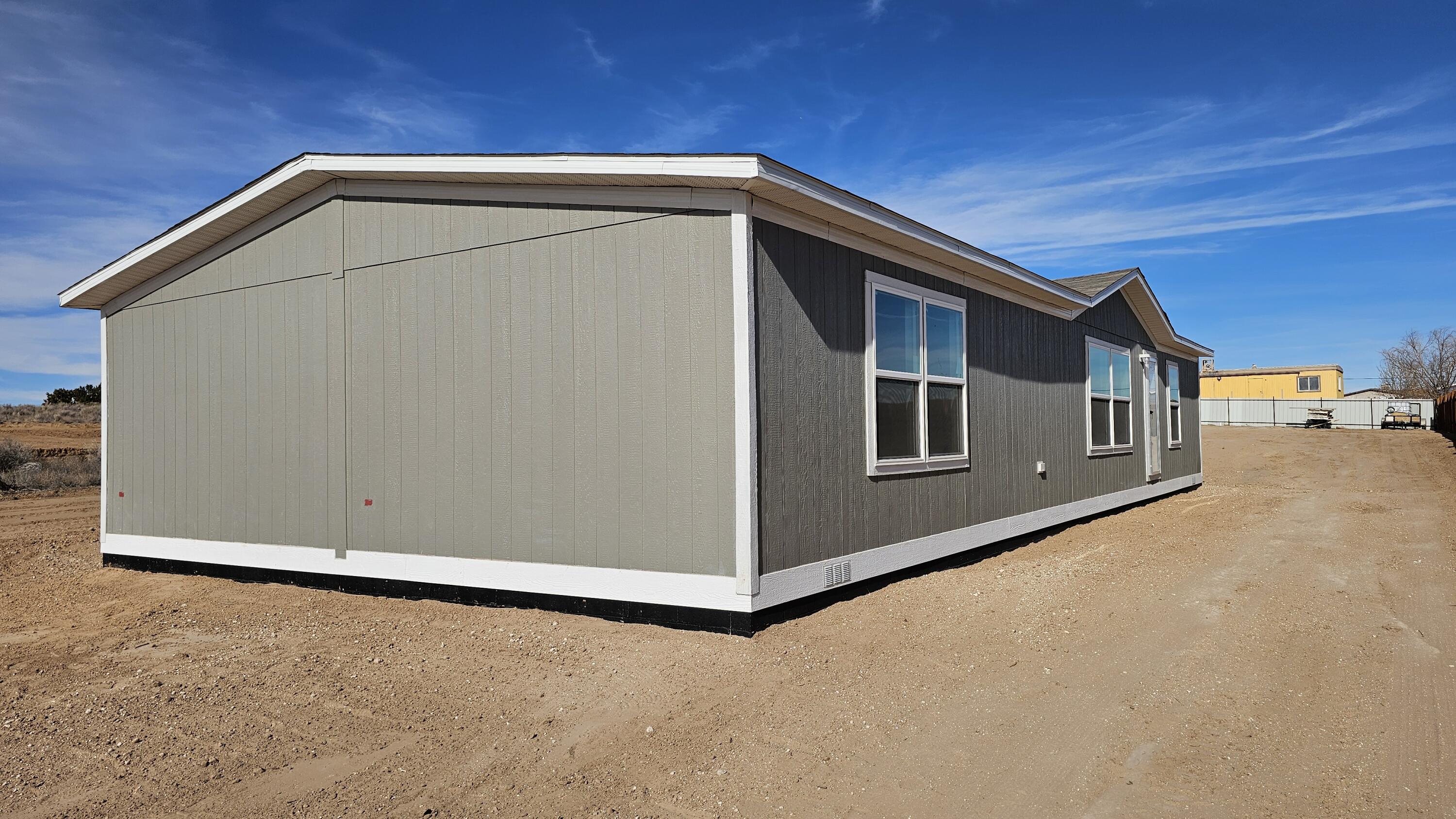 Welcome to this brand-new manufactured home on a permanent foundation situated on a generous 1/3-acre lot. This property offers modern comfort with city water, refrigerated air conditioning, and a well-designed floor plan ideal for everyday living. The 2-car garage provides ample space for parking, storage, or a workshop. Enjoy the benefits of new construction, low-maintenance living, and room to spread out on a spacious lot. A great opportunity to own a new home with land, modern features, and lasting value--schedule your showing today. ***estimated completion is Mid to Late March***