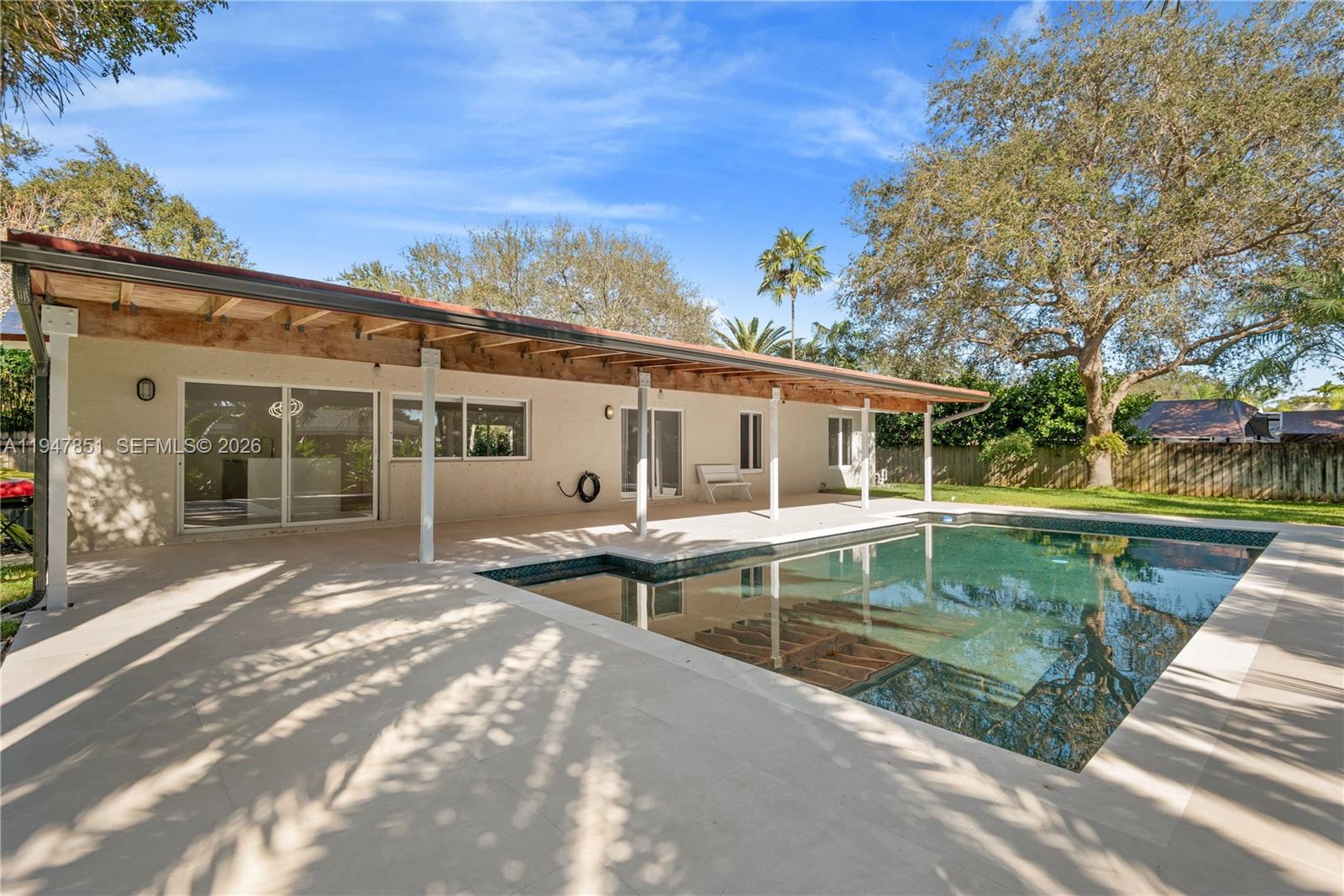 Classic, nicely renovated, one floor, 3 bedroom / 2 bath home with well appointed pool & yard on a beautiful expansive 15,625 Sq. Ft lot.Home features include: new oak floors, new bathrooms, new open kitchen, newly re-designed re-finished pool and tiled pool deck, sprinklers throughout.A true gem.