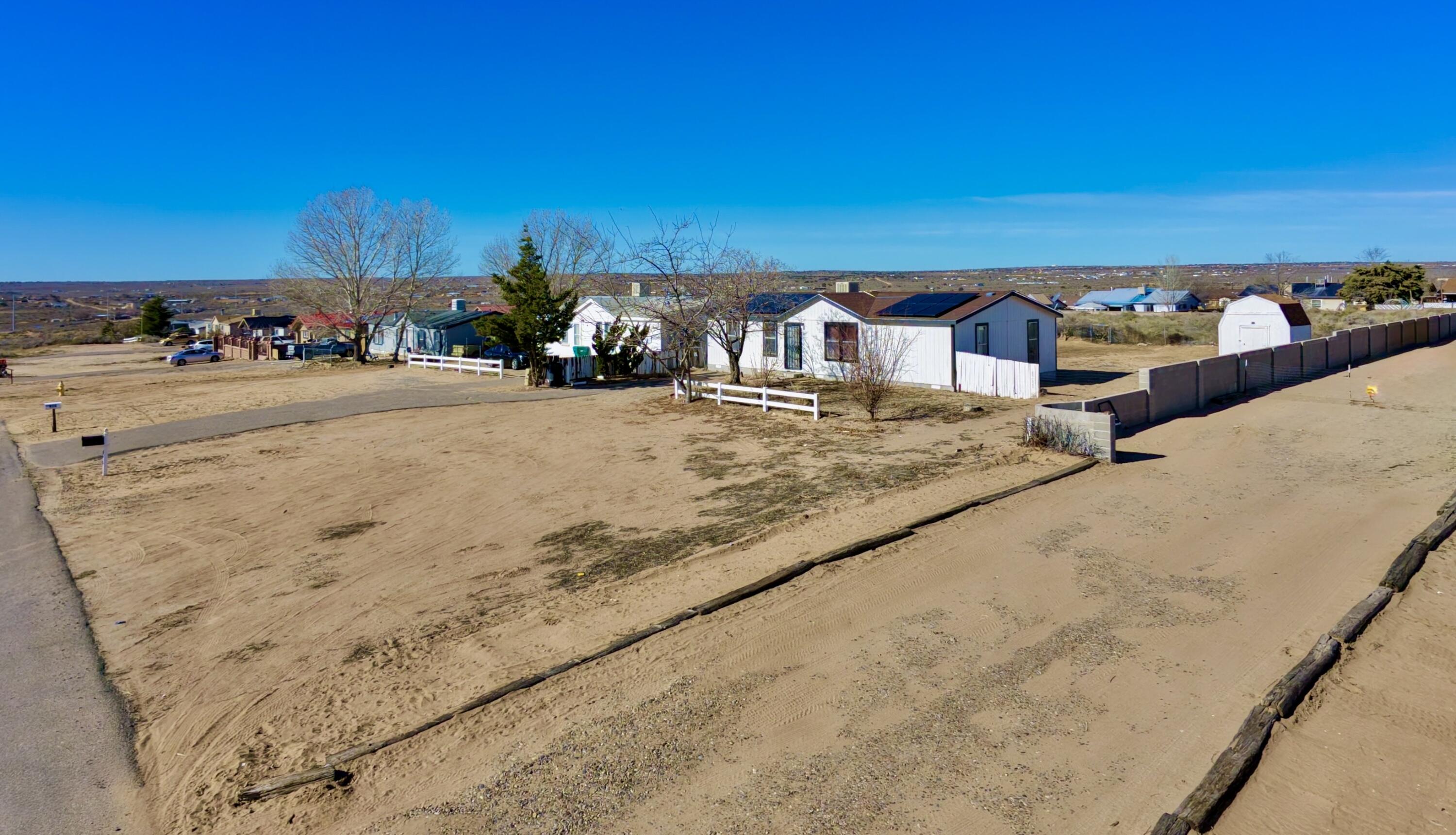 This charming 3-bedroom, 2-bath mobile home sits on a permanent foundation and offers the perfect blend of comfort and space on a 1/2 acre lot.  Inside, you'll find a beautifully updated kitchen, along with new paint and flooring that give the home a fresh, welcoming look.  whether you're first-time buyer or looking for room to spread out, this property offers value, updates, and land, ready for you to make it your own. Backyard access!