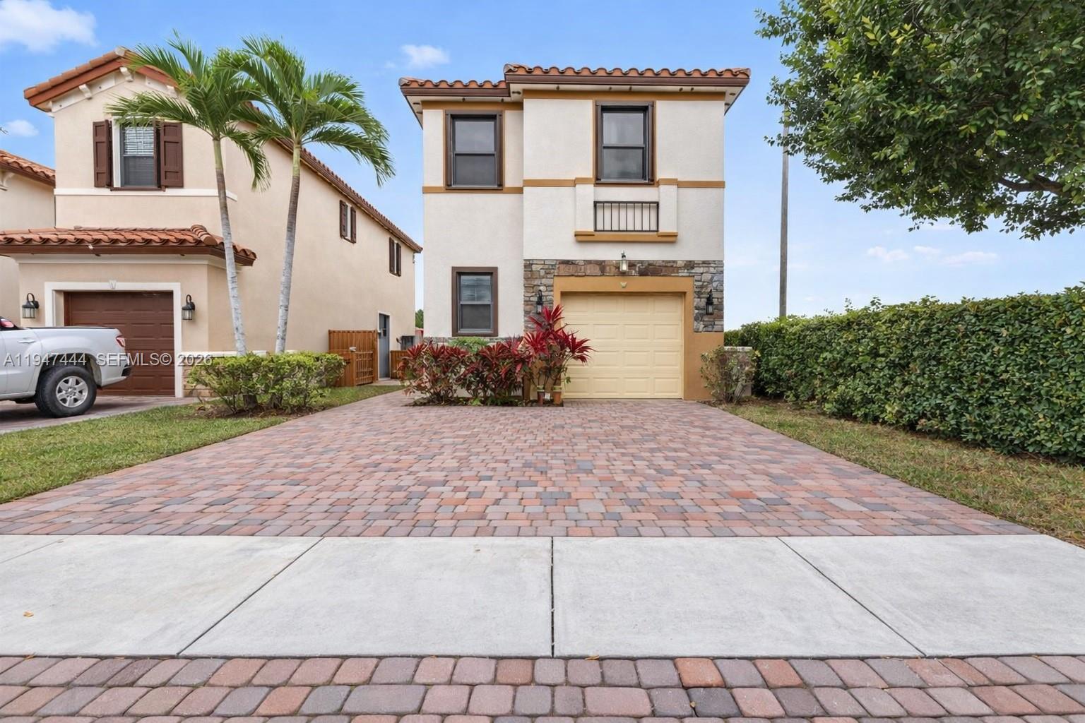 Built in 2016, this desirable 2-story corner unit in the Isles of Oasis master community offers 3 spacious bedrooms, each with its own ensuite bathroom. The home features a 1-car garage, tile floors throughout, and a low-maintenance backyard with artificial turf, perfect for outdoor enjoyment. The interior is bright and open, with comfortable living spaces and beautifully designed bedrooms. Located in a well-maintained, picturesque community with convenient access to shopping, dining, and major roadways, this property combines comfort, style, and convenience.