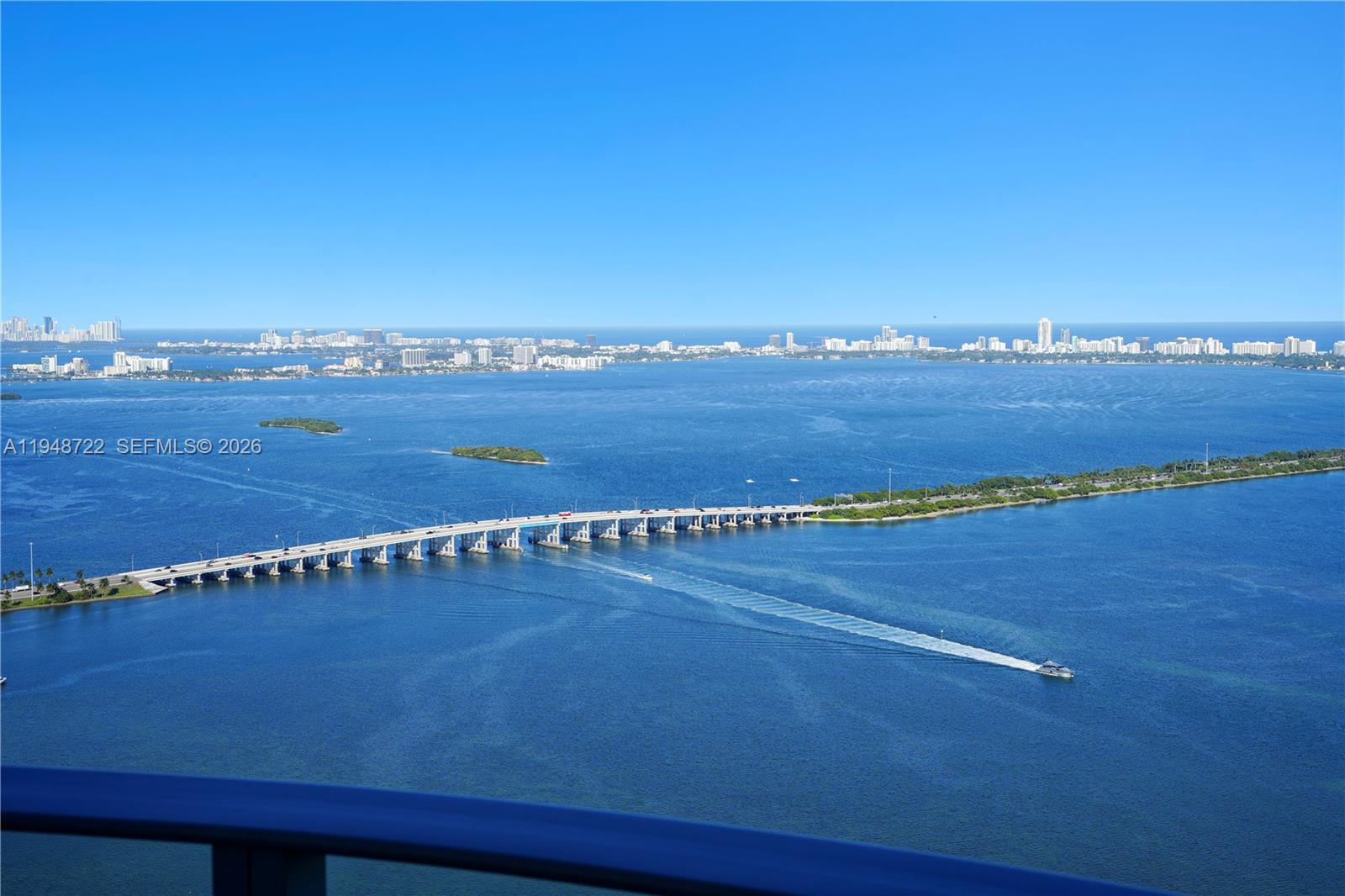 Welcome to one of the most spectacular water views in Miami. This exceptional penthouse residence at Aria Reserve South offers a rare opportunity to own brand-new construction with unobstructed panoramic views of Biscayne Bay and the Miami skyline. Designed for elevated waterfront living, this expansive 4-bedroom plus family room, 5.5-bath layout features generous open living areas, 10-foot ceilings, and floor-to-ceiling glass that fills the home with natural light. A private elevator entry welcomes you into refined interiors finished with the finest materials. The residence includes elegant custom closets with integrated lighting, a gourmet chef’s kitchen with premium appliances, modern cabinetry, and spa-inspired bathrooms. The expansive living and dining areas flow seamlessly, creating the ideal setting for entertaining or everyday luxury living. Enjoy true indoor-outdoor living from the 630-square-foot private balcony, perfect for sunrise mornings, sunset evenings, and breathtaking bay views. The unit also includes a private enclosed garage with dedicated storage, a rare and valuable feature in high-rise living. Aria Reserve South offers world-class resort-style amenities, including an infinity-edge waterfront pool, private dining room, state-of-the-art fitness center, concierge services, and beautifully curated resident spaces. An extraordinary penthouse combining architectural excellence, refined design, and one of Miami’s most impressive waterfront settings.