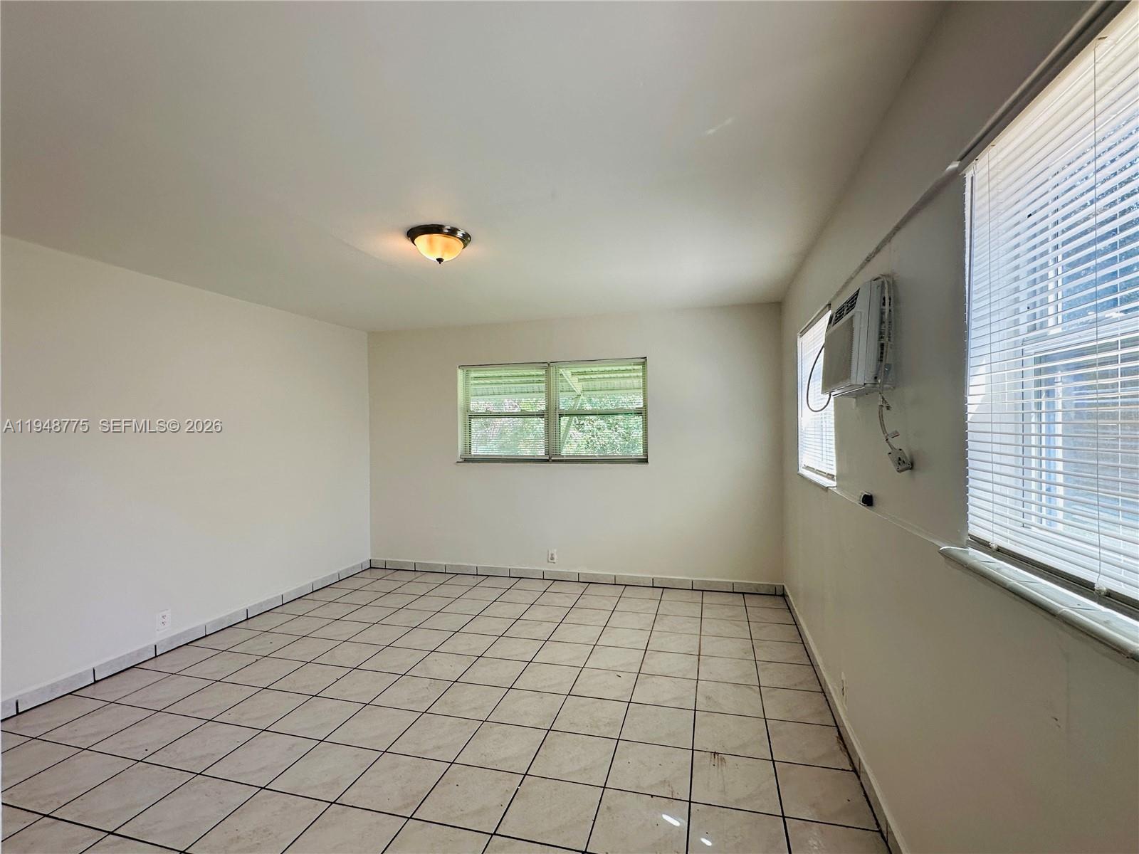 Open-concept living area at 4548 33rd Ave - Home in Dania Beach