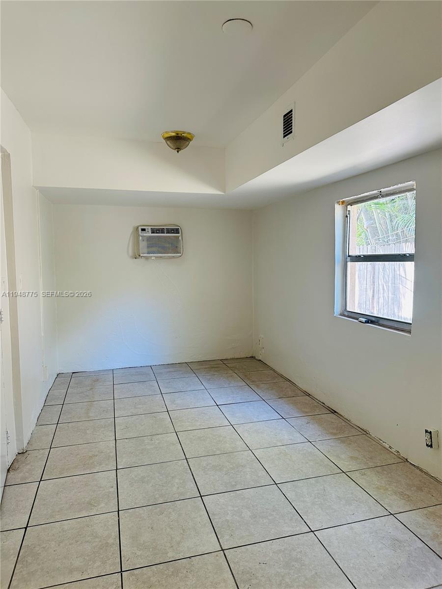 Well-appointed guest bedroom at 4548 33rd Ave - Home in Dania Beach