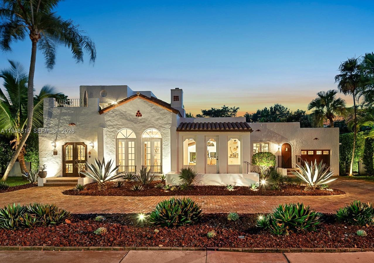 Designer-owned and completely renovated historic residence overlooking the Granada Golf Course, with awe-inspiring views of landmark banyan trees on the 6th fairway. This 4BR/3.5BA Old Spanish home seamlessly blends modern open living with preserved architectural charm, offering a rare combination of character, comfort, and move-in-ready convenience. A sun-filled, open-flow layout centers around a chef-worthy kitchen with custom Vermont-made cabinetry, Sub-Zero, Wolf & Kohler fixtures. Expansive family room opens directly to a resort-style pool & patio, ideal for indoor-outdoor entertaining. All 3 main bedrooms feature large walk-in closets. Upstairs primary suite enjoys tranquil golf course views & a charming sun porch. 4th bedroom is perfect for live-in help or in-laws. Design details include meticulously restored vintage doors, imported custom iron chandeliers, and a rare 1923 solid cast-iron soaking tub. Additional highlights include a home office with separate entrance, fully finished and air-conditioned garage currently used as a gym, commercial-grade IT with Cat 6 wiring throughout, AV, CCTV, storm windows, solid concrete block construction, and Trane central AC systems. Located outside a flood plain and adjacent to the Granada Golf Course, engineered to provide natural water absorption. A truly special Coral Gables offering—historic, refined, and turnkey—just minutes to the Biltmore Hotel, Country Club, parks, Miracle-Mile dining, and Miami International Airport.