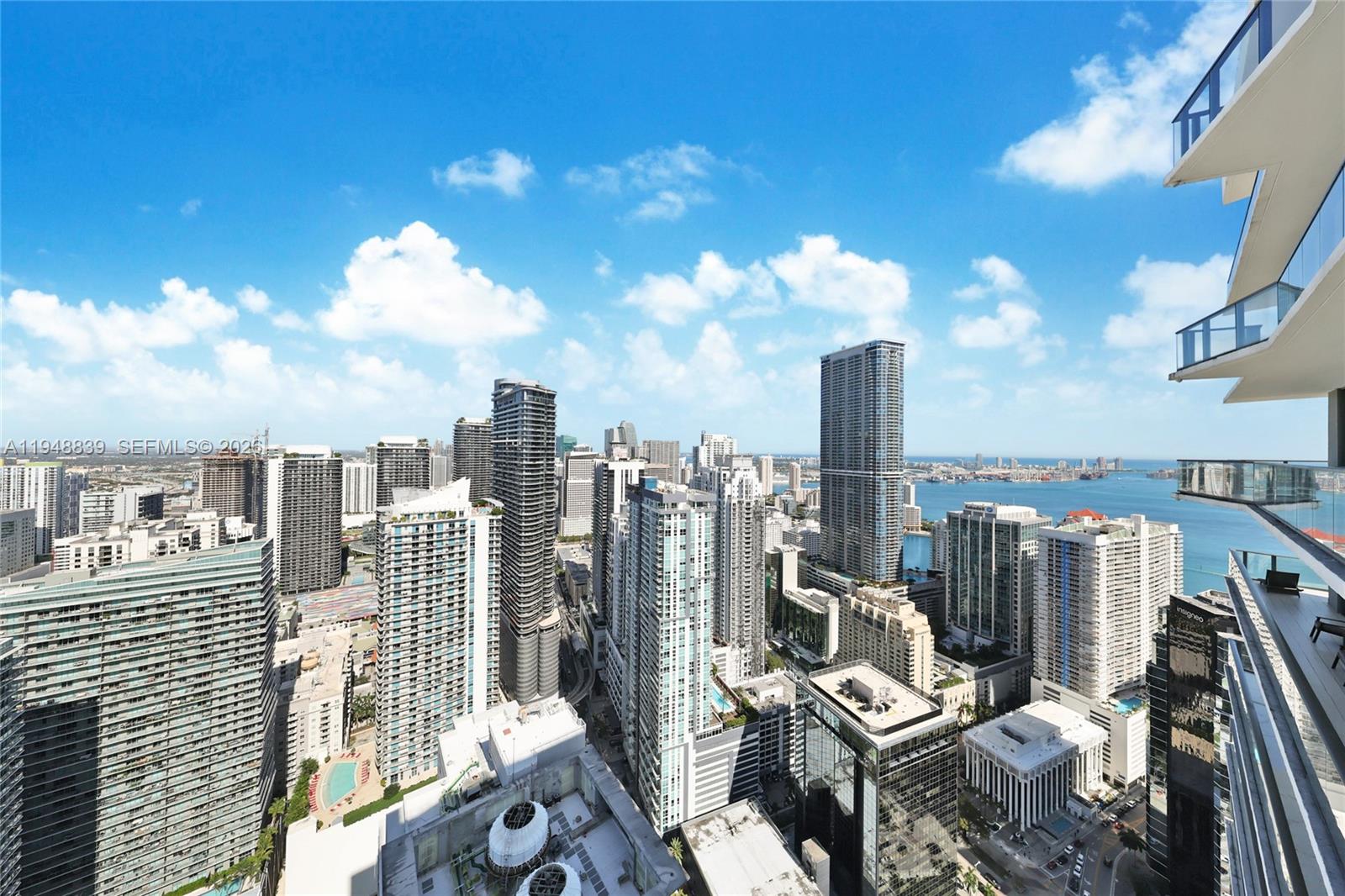 Soaring high above the city, this 3-bedroom, 2.5-bath penthouse of 1,711 SF is a rare combination of expansive panoramic views and exceptional tranquility in the heart of Brickell. Located at SLS Brickell, this residence offers refined design, generous proportions and a seamless indoor-outdoor lifestyle high above the city. The penthouse features floor-to-ceiling windows with electric blinds throughout, abundant natural light, and a living and dining area ideal for both entertaining and everyday comfort. A powder room adds convenience for guests and two assigned parking spaces, a rare and valuable offering in Brickell.Residents enjoy access to world-class amenities, full-service staff, and a prime Brickell location just steps from dining, shopping, and entertainment. Also, the building is now professionally managed by DUA, marking a significant and positive evolution for residents. Very motivated sellers.