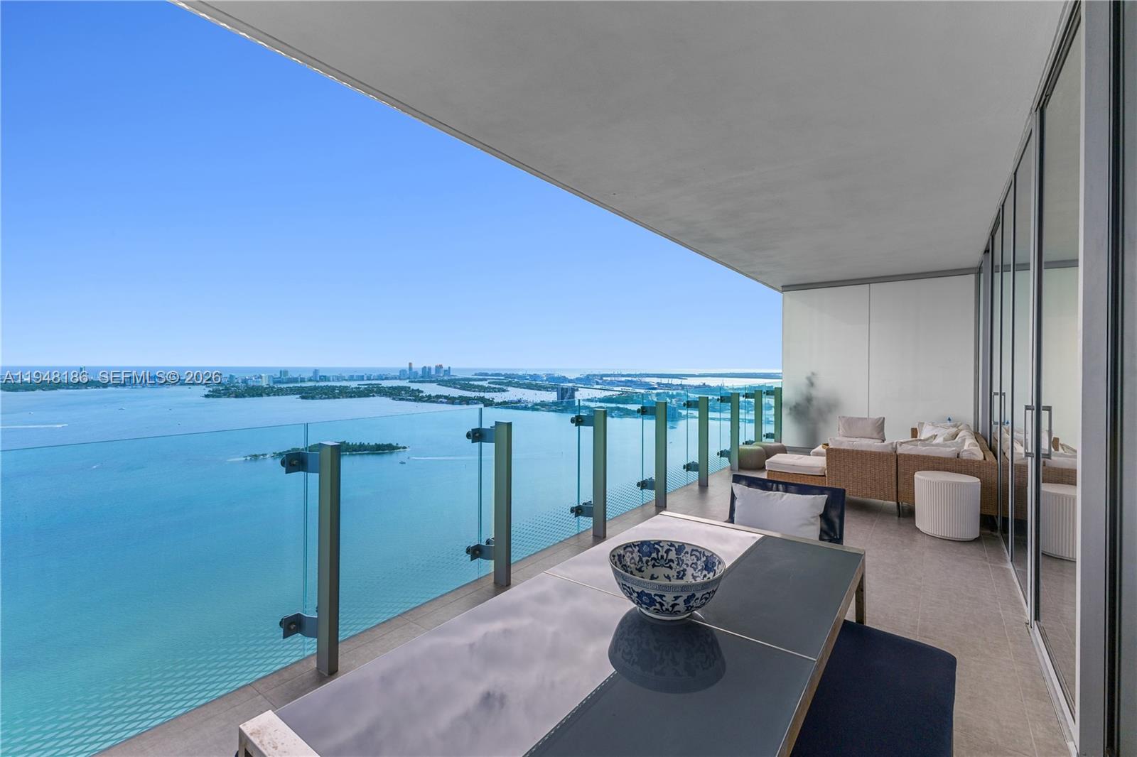 Perched on the 47th floor, this exceptional 3-bedroom, 4.5-bath residence offers 2,586 square feet of refined living with breathtaking, unobstructed views of Biscayne Bay and the Atlantic Ocean.Designed for both elegance and comfort, the residence features a spacious, light-filled layout with floor-to-ceiling glass that frames sunrise over the bay and sunset over the Miami skyline. Expansive living and dining areas flow seamlessly, creating an ideal setting for both everyday living and entertaining at scale. Each bedroom offers ensuite baths and privacy, while the primary suite delivers a true retreat in the sky.Located in a high-rise building with a boutique feel, residents enjoy an elevated lifestyle with resort-style amenities, including sunrise and sunset pools, tennis court, state-of-the-art fitness center, and thoughtfully curated common spaces designed for wellness and leisure.Ideally situated in Edgewater, just minutes from the Design District, Wynwood, Downtown Miami, and Miami Beach, this residence represents a rare opportunity to own a high-floor home combining panoramic views, generous scale, and refined amenities.Offered at $3,350,000.Private showings by appointment.