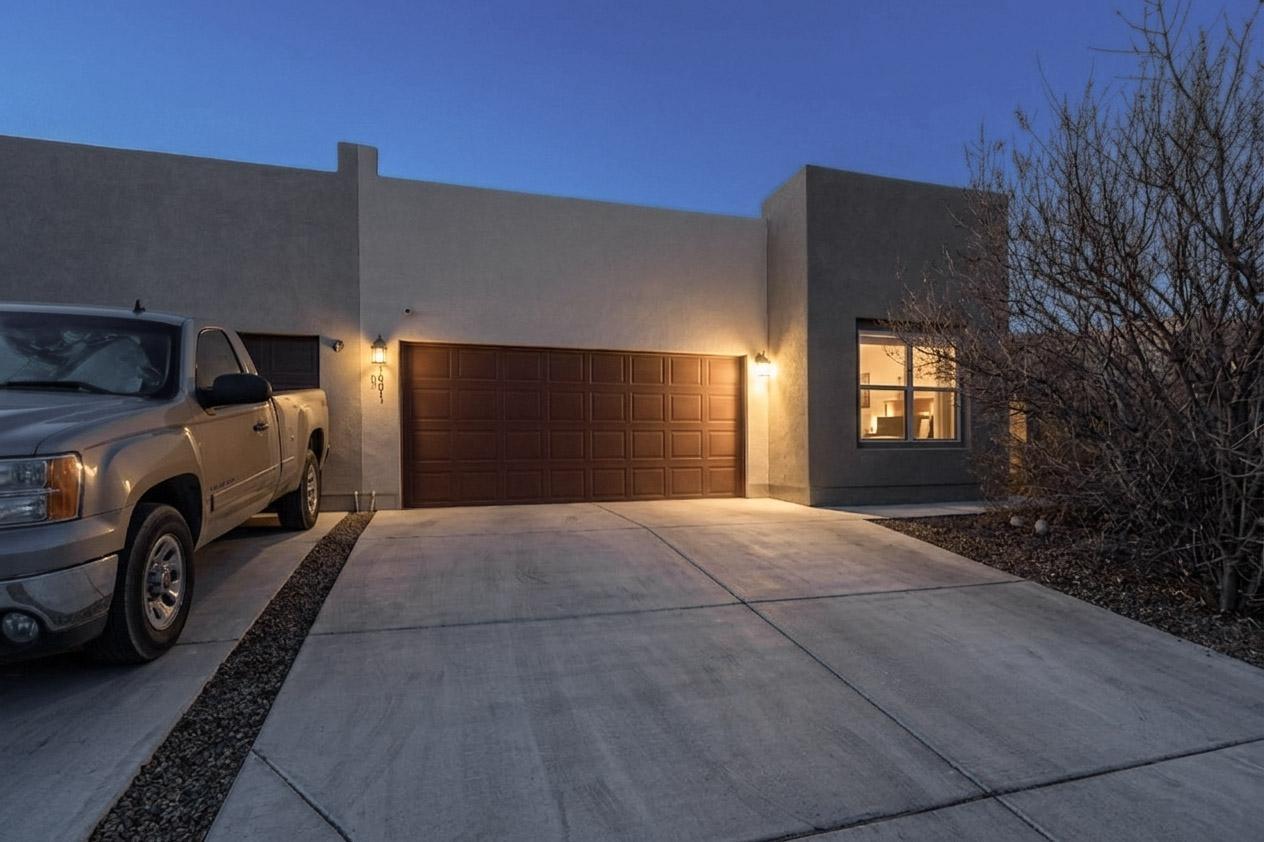 Townhome is  spacious with plenty of sunlight throughout living area has sky lights, front   faces south, Wired  Alarm system, Ceiling fans . MB has a large walk in shower and water closet, with large walk in closet and plenty of shelving.Kitchen has a nice pantry, gas stove with microwave, new Dish washer, Garage was recently upgraded. Back yard is low maintenance with artificial turf.