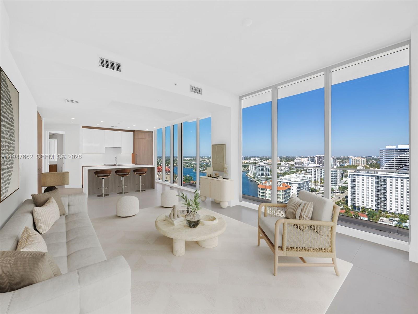 Brand new construction featuring the hottest corner line available. This exceptional two bedroom, three bath residence with an enclosed den offers direct ocean, Intracoastal, and city views from a spacious wraparound balcony. Floor-to-ceiling glass fills the home with natural light, while generous living areas and oversized walk-in closets create a refined yet comfortable living experience.An impressive suite of amenities enhances everyday living and entertaining, from movie nights and private theater screenings to catered dinners and intimate gatherings. Indoor spaces include The Wave with lounge seating, fireplace, bar, billiards, and card tables, as well as Seasons featuring a wine bar, catering kitchen, communal dining table, and reservable event terrace. Wellness amenities include a double-height fitness center overlooking tropical gardens and a glass-enclosed movement studio. The Hub offers a modern work-from-home environment with private offices, conference room, and privacy pods.Outdoors, a spectacular elevated beachfront amenity deck showcases panoramic Atlantic Ocean views with a resort-style pool, lap pool, spa, cabanas, fire pit lounges, outdoor kitchen, and poolside bar. Enjoy endless ocean vistas, blue skies, and luxury coastal living at its finest.