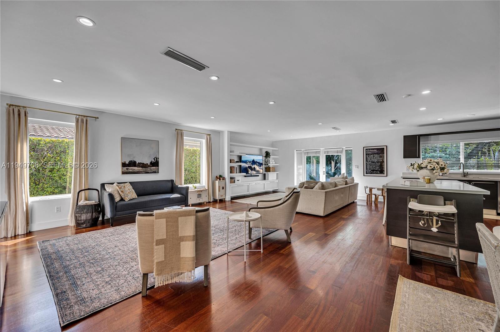 Beautifully renovated residence ideally located in the heart of Coral Gables. This home offers a seamless flow between the living, dining, family, and kitchen areas, creating a bright and inviting space perfect for both everyday living and entertaining. The open kitchen features sleek Italian cabinetry and a contemporary design. Notable upgrades include rich hardwood floors throughout, limestone-appointed bathrooms, impact casement windows, and impact-resistant French doors opening to a private courtyard patio. Additional improvements include custom built ins for storage, new plumbing, electrical, and A/C system. Tucked away on a quiet, tree canopied street, just minutes from the University of Miami, Coconut Grove, Downtown Brickell and all the dining options one could ask for!