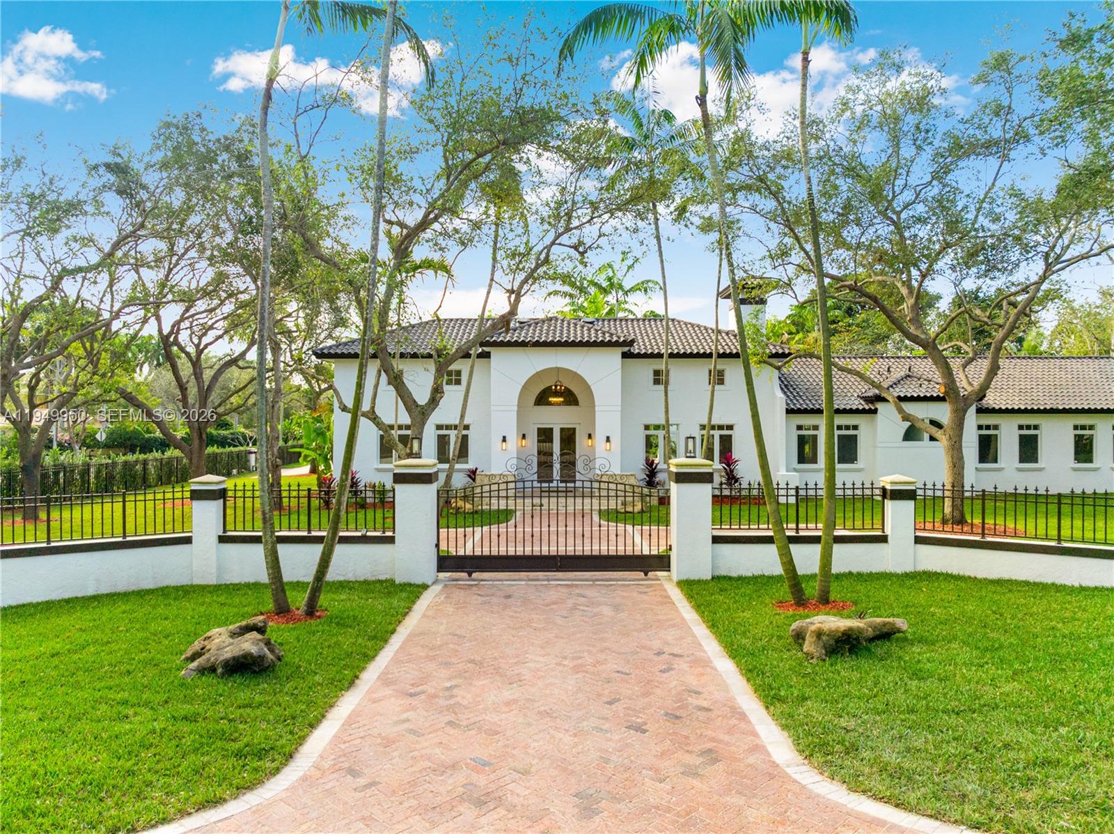 Your private oasis on a highly coveted corner lot awaits! A true builders acre this impressive gated estate delivers exceptional privacy and tranquility. The home features 6 bedrooms, 6.5 bathrooms - including a mother-in-law suite, a 3-car garage, fireplace, pool and hot tub, and generous indoor and outdoor spaces ideal for entertaining. Arrive via a quiet, tree-lined street with a lush canopy that opens to a private retreat surrounded by mature oak trees. This Mediterranean-style residence combines timeless architecture with a bright, contemporary open layout. Soaring vaulted ceilings and plentiful natural light elevate the home’s expansive, airy feel.Located in a highly sought-after neighborhood, the property is just minutes from beaches, marinas, dining, recreation, and premier shopping, and is zoned for excellent schools.Take a video tour! https://youtu.be/gA1SWNu-Uys