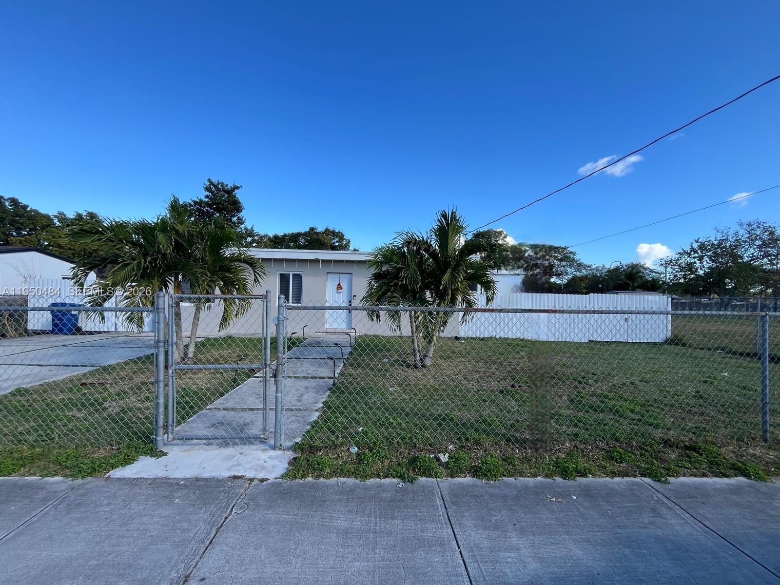 Beautifully remodeled 3/2 home in Homestead featuring a huge backyard with ample space to park both a boat and an RV. The interior showcases stunning floors, an upgraded kitchen, modern bathrooms, and spacious closets.