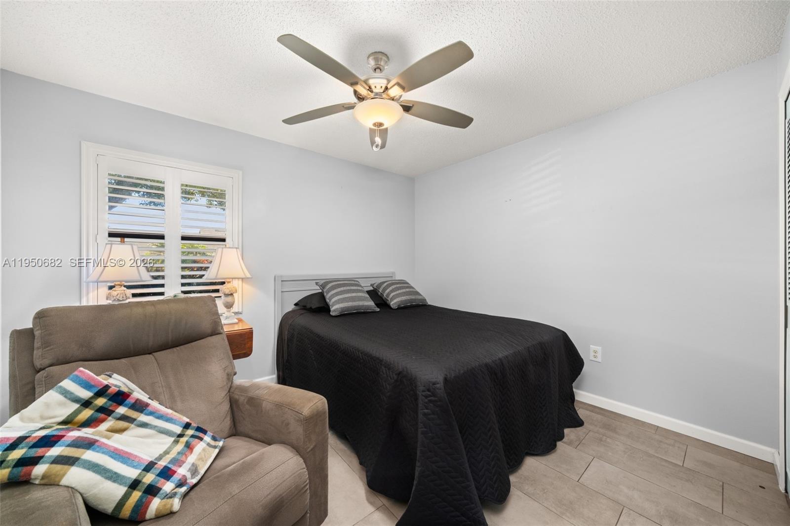 Well-appointed guest bedroom at 319 Grove - Condo in Avon Park