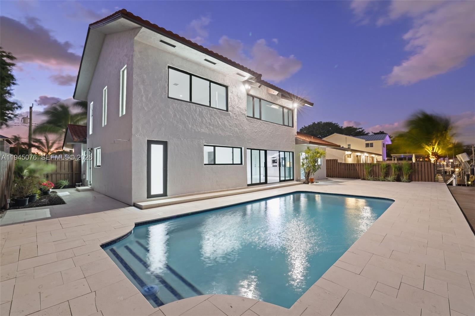 Stunning fully remodeled waterfront home in desirable Snug Harbor with ocean access via canal (1 fixed bridge – Federal Hwy). Located on a quiet dead-end street with no HOA. This move-in-ready residence features a modern open-concept layout with vaulted ceilings, brand new chef’s kitchen with granite countertops, new flooring throughout, and fully renovated spa-style bathrooms. Impact windows and doors provide security and energy efficiency.Enjoy true South Florida waterfront living with a 70' waterfrontage, and direct access to the Intracoastal and ocean. Private backyard oasis includes a resort-style pool and new pavers.Additional features include a stone-coated steel roof , office on main level, spacious primary suite with loft, walk-in closet, and 2 car garage. Conveniently located near beaches, dining, shopping, and major highways. A rare opportunity to own a turnkey waterfront home.