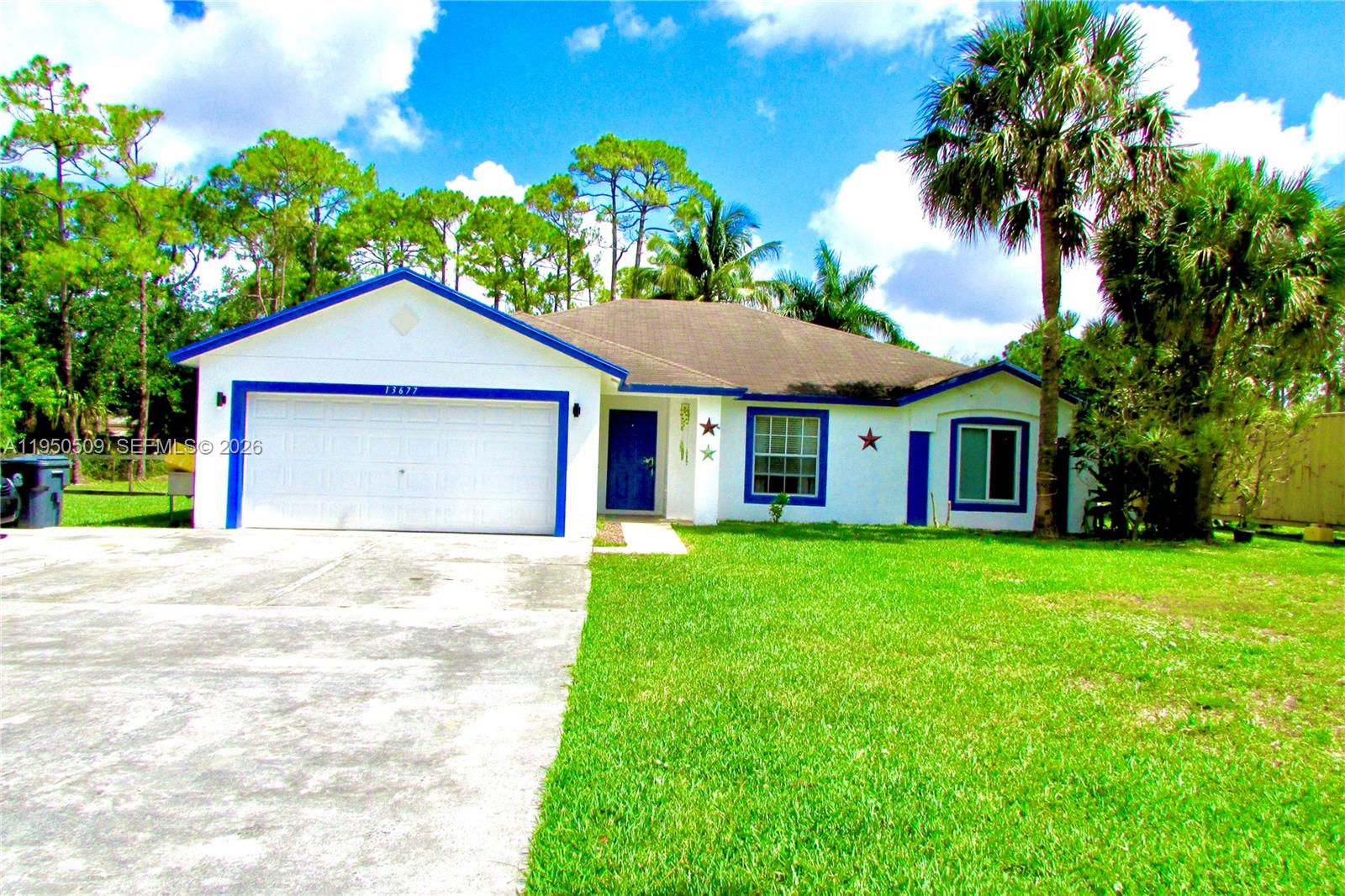 Welcome to 13677 Temple Blvd., a well-maintained home located on over one acre in a highly sought-after acreage neighborhood along a PAVED ROAD. This fully fenced property offers privacy, security, and ample space for animals and outdoor enjoyment. The expansive yard includes a BARN suitable for horses, open land for multiple uses, and two CONEX Containers ideal for secure storage, workshop space, or future creative projects, including potential guest accommodations (subject to local regulations).Inside, the home features a split-bedroom layout providing added privacy, along with bright, open living areas that create a welcoming atmosphere. The Galley-style Kitchen is designed for efficiency and functionality, offering easy access to the main living spaces. A screened-in patio provides the perfect setting to relax and enjoy peaceful views of the surrounding property year-round.Recent updates include a NEWER ROOF, HVAC system, updated bathroom vanities, and water system, offering peace of mind and long-term value. Conveniently located with easy access to major attractions and destinations throughout South Florida, this property offers the ideal balance of space, privacy, and accessibility.