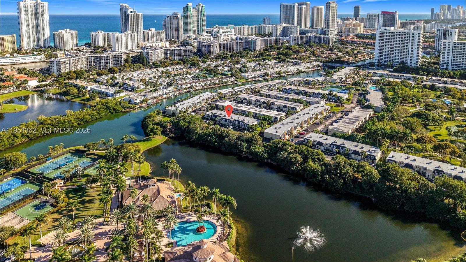 The best-priced 3BR/2.5BA townhouse in the highly desirable Three Islands community of Venetian Park! This 2,083 sqft spacious Three Islands gem offers the ultimate peace of mind with major capital upgrades already checked off your list: newer roof (2024), full hurricane-impact glass windows and sliding doors, a tankless water heater, and freshly painted. Seller has paid all special assessments in full, and the townhome exterior is scheduled to be professionally repainted this year! The interior features a bright split floor plan with a dedicated dining area, functional kitchen equipped with warm wood cabinetry, stainless steel fridge & stove, and in-unity laundry. Enjoy a master suite with a private balcony and ample storage. Step outside to a private fenced backyard, perfect for pets and entertaining. Includes two assigned parking spaces and can rent immediately with no waiting period. Monthly maintenance covers water, sewer, trash, cable, internet, landscaping, and more. Direct access to Hallandale Beach's Joseph Scavo Park, featuring lush trails and dog parks, 5 minutes to the beach and Aventura Mall, and 20 minutes to FLL Airport.