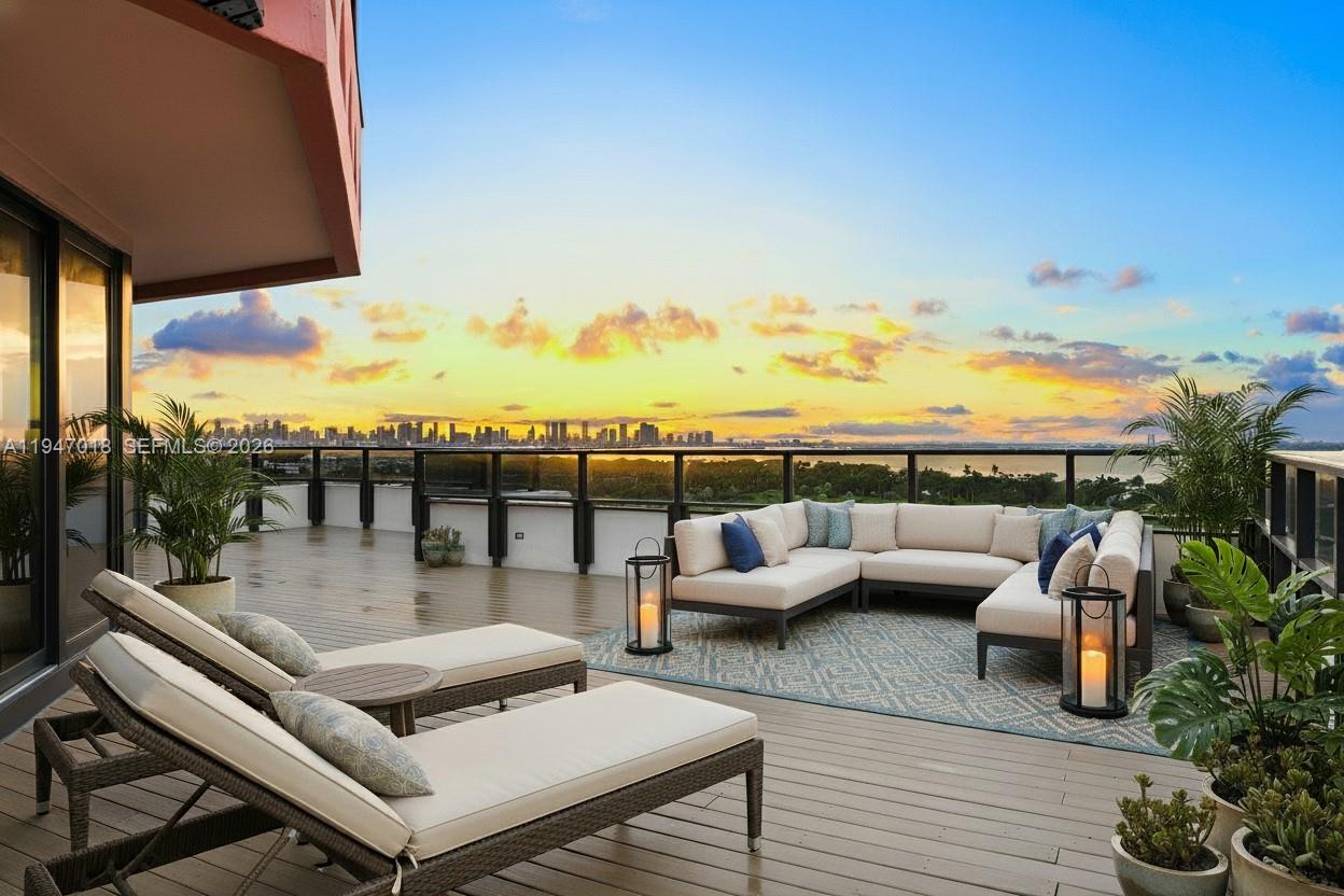 A legacy two-story penthouse in The Alexander, offering five bedrooms, eight full baths, and two half baths, this grand residence opens with a double-height foyer and a staircase that sets an impressive tone throughout. Sunrise and sunset views, along with panoramas of downtown Miami, the Intracoastal, and the beach, fill every major room, including an expansive formal living area, an elegant dining room, and a spacious kitchen with a breakfast area. A large informal living space opens to a balcony overlooking downtown Miami, and the in-unit elevator provides seamless access between floors. The home features a rare two-story office, a private theater room, a full laundry room, and separate staff quarters complete with its own kitchen and bathroom. The primary suite offers dual walk-in closets, a separate soaking tub and shower, and a wide balcony with gorgeous skyline and sunset views. Secondary bedrooms are generous in size and ensuite, while a dedicated game room connects to an oversized private terrace facing the beach. Residents enjoy a direct beachfront setting on Collins Avenue with immediate access to the sand and boardwalk, along with two pools, an on-site restaurant and poolside bar, a fitness center with sauna, spa services, beach service, and valet parking. With its scale, privacy, and exceptional layout, this penthouse lives like a true estate. All utilities included in the maintenance.