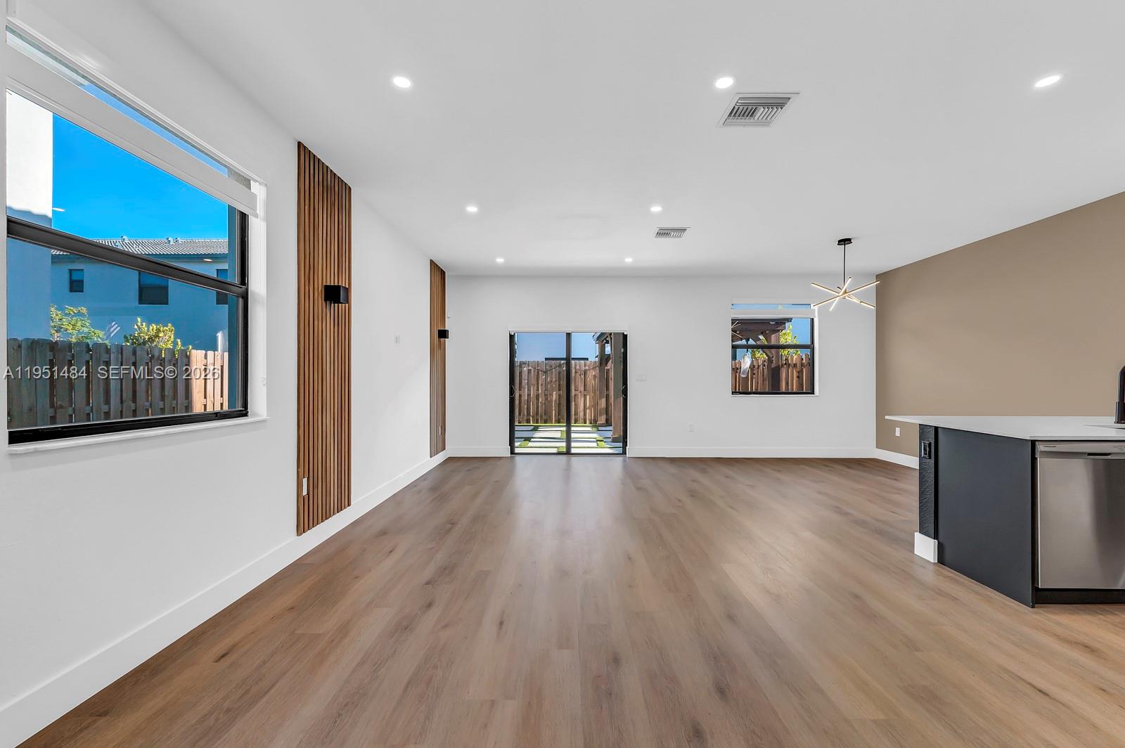 Calling all investors! This MASSIVE 4-bedroom, 3-bathroom corner unit feels more like a single-family home than a townhome. Currently leased at $3,500/month to an amazing tenant through August 1, this property delivers strong immediate cash flow with zero vacancy risk.Offering the largest layout in the community, this home features spacious living areas, a full bedroom and bathroom on the first floor, and a beautifully designed open layout perfect for long-term tenant appeal. The property also boasts a fully finished, fenced-in backyard with concrete pads—ideal for low-maintenance outdoor living.With modern finishes, a well-kept interior, and major systems in great condition, this is a true plug-and-play investment opportunity. A rare chance to own an oversized 4/3 corner unit with a reliable tenant already in place.